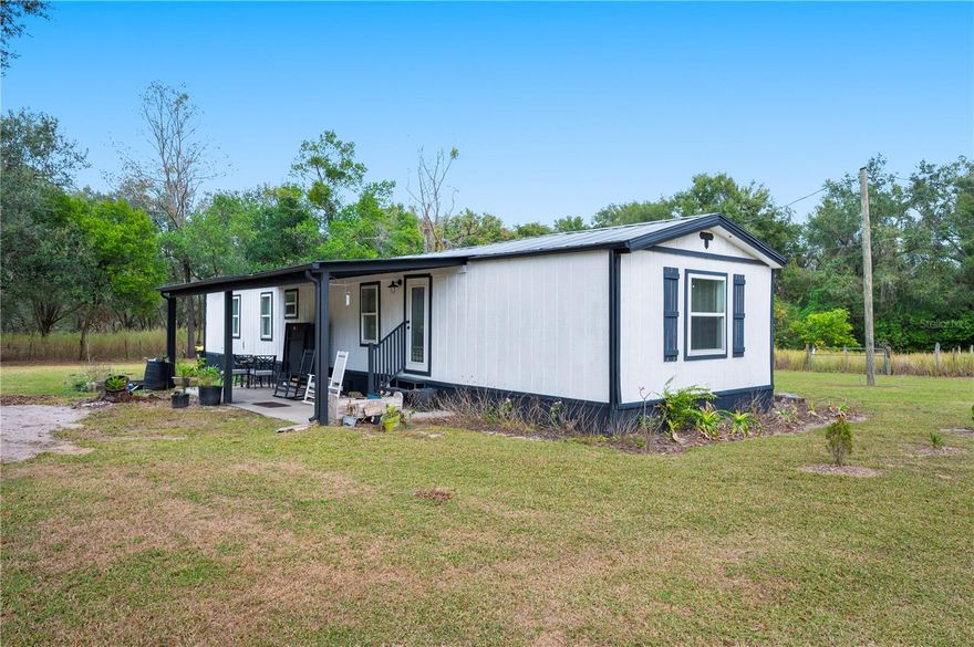 One-of-a-kind South Lakeland retreat offering the perfect blend of country charm and city convenience. 
This fully updated 2-bedroom, 2-bath home sits on a private half-acre with gated access and no rear neighbors. Inside, the partially furnished open-concept living space feels bright and inviting, anchored by a beautifully updated kitchen featuring a butcher-block island that's ideal for both everyday living and entertaining.
The spacious primary suite includes a fully remodeled en-suite bath with a large walk-in shower and a walk-in closet that conveniently houses the washer and dryer. The second bedroom is located at the front of the home and offers easy access to the updated hall bath, making it perfect for guests or a home office.
Step outside to a cozy covered back porch complete with rocking chairs and a ping-pong table—an ideal spot to unwind and enjoy peaceful views of the expansive garden and pasture beyond, home to adorable baby goats. The property also includes a shared agricultural area with chicken housing (yes, chickens are allowed!).
Enjoy quiet, rural living just minutes from modern conveniences—shopping and dining are only a 2-minute drive away. Outdoor enthusiasts will love being less than a quarter mile from the Fort Fraser Trail, a paved 7.75-mile multi-use path perfect for biking and walking. Located under 5 minutes from the Polk Parkway, providing easy access to Tampa and Orlando.
A rare opportunity to enjoy privacy, charm, and convenience—all in South Lakeland. 
Property does include some additional leasing terms that can be provided by listing office.