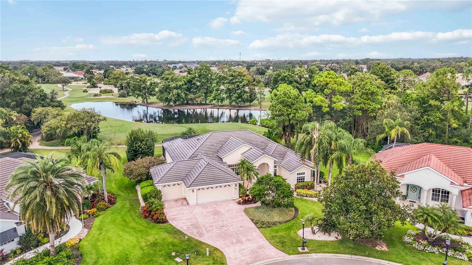 Nestled at the end of a peaceful cul-de-sac of the elite 'French Quarters' subdivision of Tara Golf and Country Club, is a rare opportunity for you to call this property 'home'.
Located on the ultimate parcel, including a Class 'A' golf membership, and offering over $200,000 in remodeling updates, you'll discover paradise as soon as you walk through the front door. This home features one uniform tile floor throughout, upgraded baseboards, crown molding and an airy split floor plan that includes a flex room—perfect for a home office, craft room or hobby space. Even more, you'll have peace of mind with the Seller offering a 1-year home warranty for the lucky Buyer!
The primary bedroom is a true retreat, offering a spa-like en suite with a stand alone soaking tub, dual sinks, modern finishes and a rainfall shower head. All other bathrooms and half bathrooms have been thoughtfully remodeled with new vanities and toilets as well. You will enjoy entertaining in the updated kitchen, boasting stainless steel appliances, a brand new wine refrigerator, and quartz countertops.
You'll love that all exterior doors are impact resistant in addition to the additional space that the 3-car garage provides. One show stopping feature that sets this home apart is the incredible view from your heated, saltwater pool and spa. Views of the pristine golf course overlooking the 15th fairway will take your breath away---especially seeing it through the new panoramic screen enclosure. The outdoor kitchen and expansive patio area is ideal for entertaining while soaking in your private retreat. This is Florida living at its finest.
Tara Golf and Country Club is a vibrant community where leisure and luxury meet. Enjoy mornings on a beautifully manicured golf course, afternoons at the tennis courts, or revitalizing sessions in the fitness center and sauna. Gather with friends at the elegant clubhouse for fine dining, casual meals, or weekend brunches. Conveniently located near I75, shopping and restaurants, this home truly checks every box. Don’t miss your chance to own this exceptional home in a luxurious golf course community.