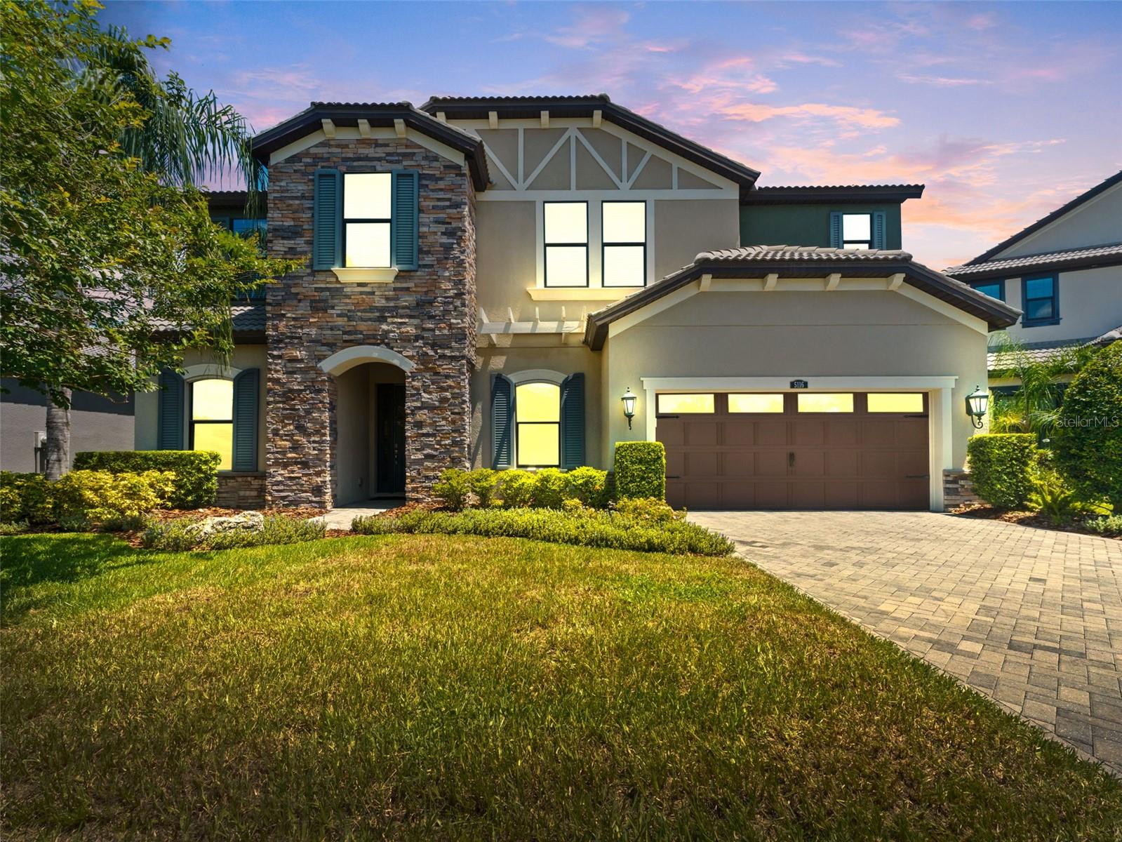 Welcome to your dream home in the exclusive gated community of Reserve at Lake LeClare, where luxury meets functionality in one of the most sought-after neighborhoods within the Steinbrenner School District.
This spacious 5-bedroom, 3.5-bathroom pool home offers the perfect blend of elegance and everyday comfort. From the moment you step inside, you’ll be impressed by the inviting and thoughtful layout designed for modern living. The gourmet kitchen has stainless steel appliances, a large center island– ideal for entertaining or casual family meals.
The open-concept living and dining areas overlook the beautifully screened custom pool and lanai, creating a seamless indoor-outdoor living experience. Whether you’re hosting gatherings or relaxing on a quiet evening, the private backyard oasis offers the perfect retreat.
The luxurious owners suite is conveniently located on the main level and includes a spa-like en-suite bath with dual vanities, a soaking tub, separate shower, and a generous walk-in closet. The downstairs has a guest wing with a full bedroom and bathroom. You will also find an office / den that can easily be converted into a bedroom. Upstairs, you’ll find three additional bedrooms—perfect for guests or multi-generational living—as well as a spacious loft ideal for a game room, office, or second family room.
Additional features include a 3-car garage, smart home upgrades, laundry room, and ample storage throughout.
Ideally located just minutes from the Veterans Expressway, shopping, dining, and parks—this home truly has it all in a great neighborhood.