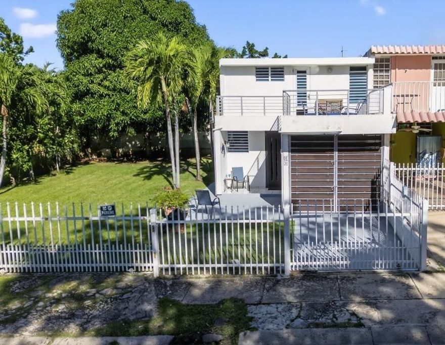 Beachside fully furnished townhouse in sought after Vista Azul community on Calle Cambija. What truly sets this property apart is the included additional adjoining lot, providing rare extra outdoor space perfect for a boat, camper, garden, or expanded yard.  What is amazing about this property is its proximity to the beach - just a few steps. Walk to the Harbor Restaurant, the Marina, and downtown Rincón’s restaurants, shops, and Thursday Artwalk.  Features include an enclosed garage with laundry, aluminum doors throughout, two French doors to the patio, an open living/dining area, and a kitchen with electric stove and refrigerator. A half bath is also on the main level.  Upstairs are three A/C bedrooms, including one with a terrace and a small ocean view. A security door tops the tiled stairwell.  A 1999 Jeep Grand Cherokee is included in the sale. Annual taxes are about $1,180. Everything conveys except personal items and clothing.  Proof of funds or PR lender pre-qualification required for showings.  Call now!