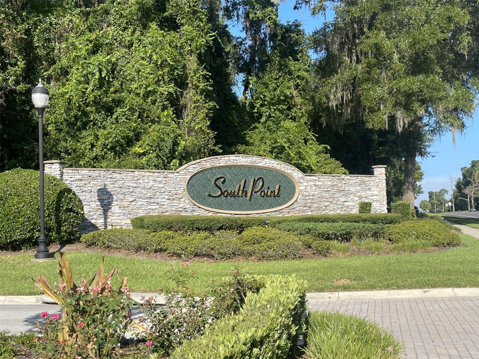 This generous 1.10-acre homesite in South Point delivers elegance, space, and location in one. Just steps from the community’s distinguished gated entry, yet set back for peaceful seclusion, the property offers the flexibility to design a stunning custom home that meets the 3,500+ square foot requirement. South Point’s gated setting, upscale character, and proximity to all that Southeast Ocala has to offer make this an exceptional place to build. Additional contiguous parcels are also available, offering the option to expand your homesite for even more space and privacy. These three contiguous wooded parcels—1.00, 1.10, and 1.12 acres—can be purchased separately or combined to create an extraordinary estate.