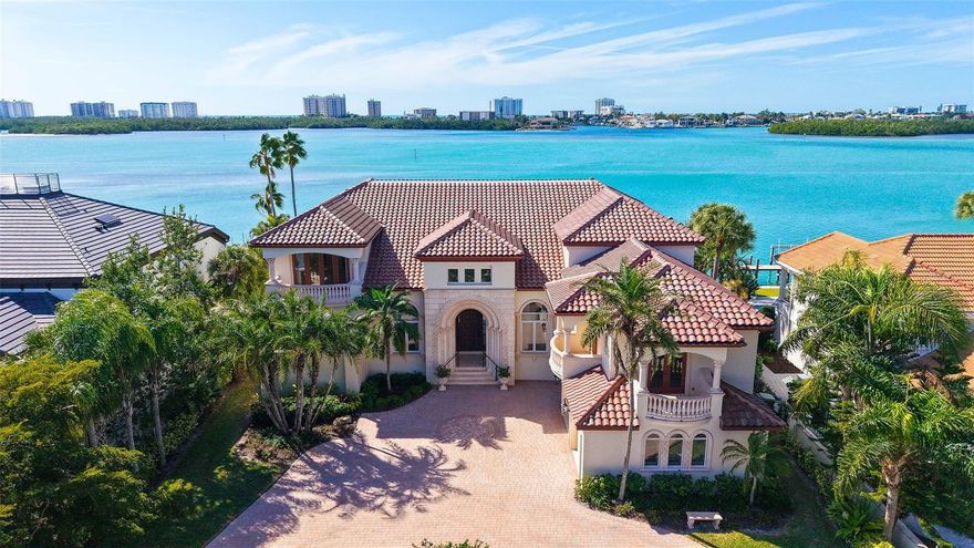 Welcome to an exceptional waterfront residence on coveted South Spoonbill Drive, where refined luxury meets Sarasota’s most desirable coastal living. This impressive 5 bedroom, 6.5 bath estate spans 6,846 square feet and is thoughtfully designed for discerning luxury buyers, ideally located on the open water with stunning views towards Lido Key. Soaring ceilings and expansive living areas create a grand yet welcoming atmosphere, filled with natural light and elegant architectural detail. The home offers a seamless flow for both intimate gatherings and large-scale entertaining, enhanced by an elevator providing convenient access across levels. The main-level primary suite serves as a serene retreat with direct access to covered outdoor living areas, allowing you to wake to tranquil water views and gentle coastal breezes. Outdoors, the home truly shines. Enjoy covered outdoor living, a resort-style pool and spa, and 100 feet of updated seawall complete with a private boat lift, providing immediate access to Sarasota Bay and beyond. Completing the estate is a 3-car garage, providing ample space for vehicles, storage, and seasonal convenience. Additional highlights include a new tile roof, an updated seawall, and beautifully maintained grounds designed for year-round enjoyment. Perfectly located just minutes from downtown Sarasota, Lido Beach, and St. Armands Circle, this property offers unparalleled access to world-class dining, shopping, and cultural attractions. Adding to Bird Key’s appeal, the new Bird Key Yacht Club, scheduled for completion in 2026, will feature lighted tennis courts, a fitness center, and a restaurant, further elevating the lifestyle this community offers. This is a rare opportunity to own a premier open-water estate in Sarasota’s most exclusive neighborhood.