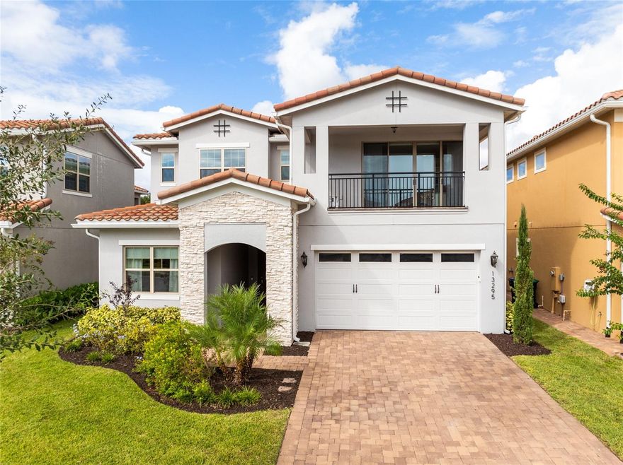 Welcome to luxury living in Eagle Creek—one of Lake Nona’s most sought-after gated golf communities. This stunning 5-bedroom, 5.5-bath residence perfectly blends elegance and everyday comfort with water views, spacious living, and thoughtful design throughout.

Step inside to an inviting open floor plan highlighted by natural light, tray ceilings, and designer finishes. The gourmet kitchen features sleek quartz countertops, double ovens, a gas cooktop, walk-in pantry, and a large island that opens to the dining area and great room—ideal for gathering and entertaining. A wall of glass sliders extends the living space to the covered lanai, where you can dine al fresco or relax while overlooking the tranquil water.

Upstairs, the expansive primary suite offers serene water views and private access to a covered balcony—the perfect place to enjoy your morning coffee or sunset breeze. The spa-inspired bath features dual vanities, a large glass-enclosed shower with pebble flooring, and a spacious custom closet with built-ins. Every bedroom in the home includes its own ensuite bath, offering privacy and comfort for family and guests alike.

The second-floor loft serves as the ultimate hangout, complete with a wet bar and space for a theater setup or game nights. Outside, the fully fenced backyard features premium artificial turf, ideal for low-maintenance play and entertaining year-round.

Eagle Creek residents enjoy resort-style amenities including a pool and splash zone, clubhouse with gym and event space, lighted tennis courts, playground, dog park, and multi-use fields. Golf lovers will appreciate the community’s championship course, pro shop, and on-site restaurant—all just steps away. Zoned for top-rated Lake Nona schools and moments from Medical City, shopping, dining, and theme parks, this home delivers family-friendly luxury in one of Orlando’s premier locations.
