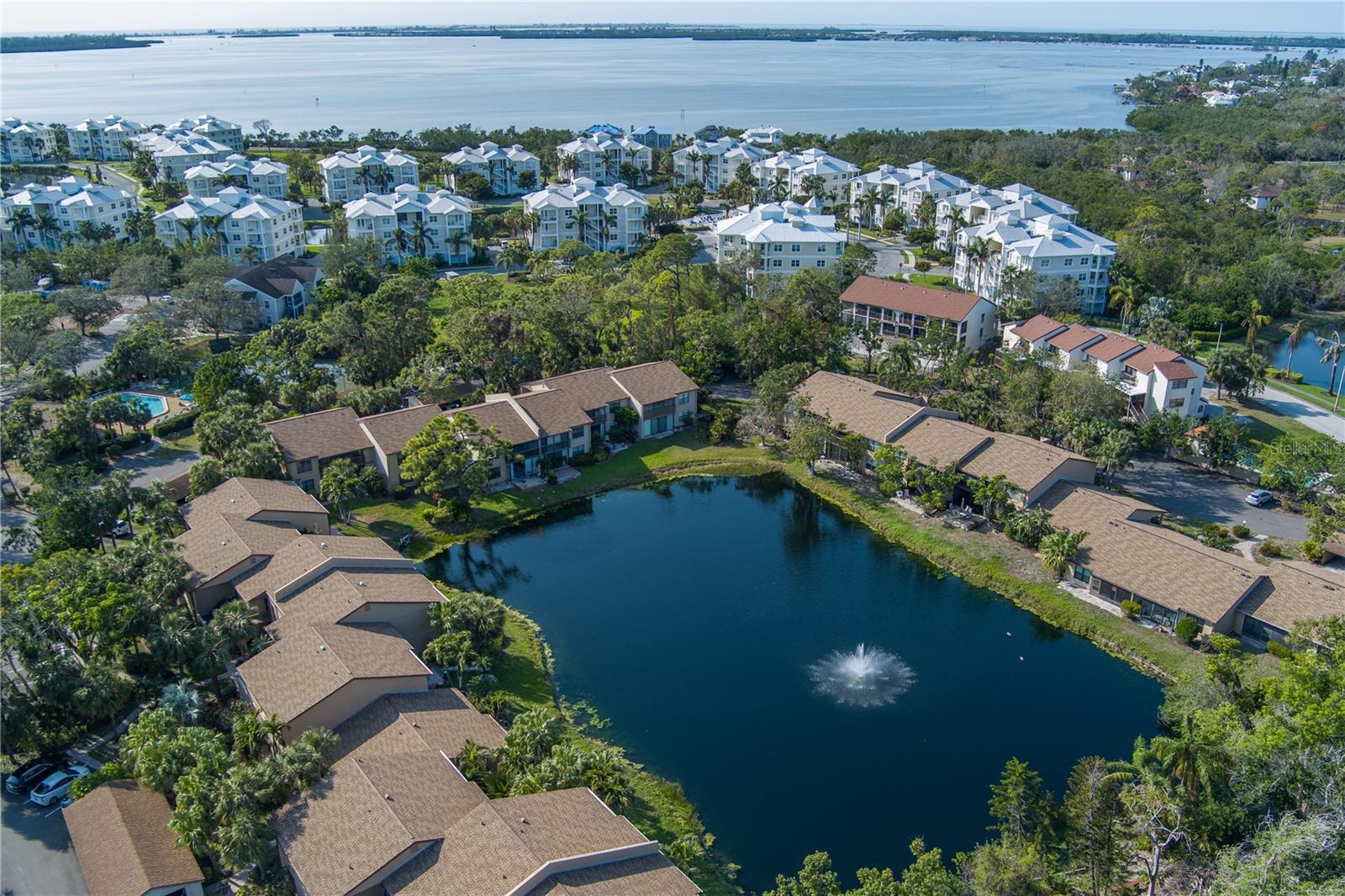 This fully furnished condo is a rare gem, nestled in a serene and exclusive enclave of just 43 residences. With a flexible rental policy, it presents the ideal opportunity to lease seasonally and enjoy as a personal retreat throughout the year.
From the moment you enter, you’re welcomed by expansive lake views framed by lush greenery, where ducks and geese glide peacefully across the water, creating an atmosphere of tranquility and natural beauty. The open-concept layout features a generously sized eat-in kitchen with a pantry—ready for your unique touches and updates to make it truly your own.
The thoughtfully designed split-bedroom floor plan offers privacy and comfort, with each bedroom boasting spacious walk-in closets. The primary suite offers serene water views, providing a calming start to each day. As one of the largest floor plans in the community, this residence offers an exceptional sense of space and livability.
Indoor and outdoor living blend seamlessly with a fully enclosed lanai, complete with full pocket sliders that invite the outdoors in. Just steps from your door, the community pool is maintained at a comfortable 85 degrees year-round for your enjoyment. For those who appreciate an active lifestyle, a private tennis court easily converts into two pickleball courts, enhancing your recreational options.
Elegant laminate flooring throughout and upgraded 5¼-inch baseboards add a refined touch to the home's inviting interior. Additional conveniences include a dedicated carport and ample guest parking for your visitors.
Located just minutes from the beach, this welcoming community combines peaceful lakeside living with easy access to coastal amenities. Don’t miss this exceptional opportunity to own a turnkey residence that offers comfort, elegance, and a lifestyle of relaxed sophistication.