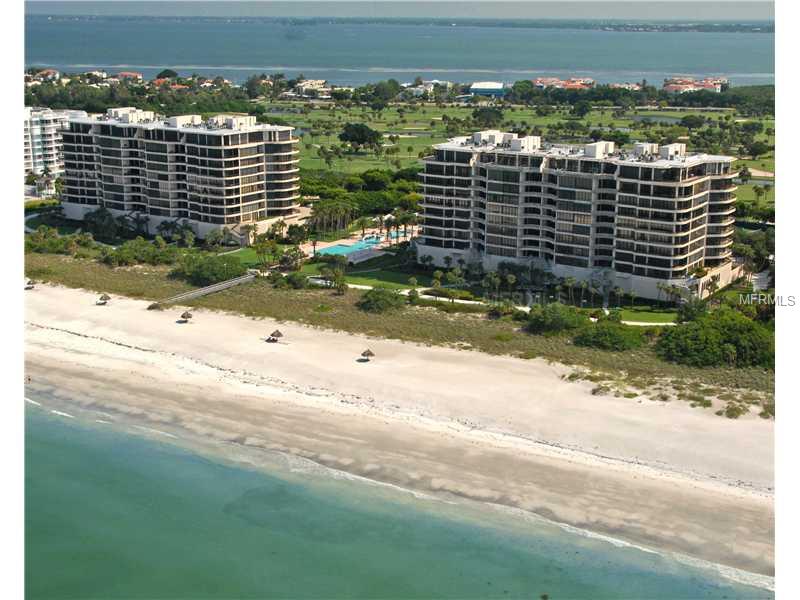 HYPNOTIC and PRIVATE views of the Gulf and Bay from this perfect 5th floor residence. 180 degree views of the Gulf of Mexico with spectacular sunsets, sometimes, a green flash sunset. As you step out of your private elevator you are in your luxurious homewith 10' ceilings and unbelievable unobstructed full Gulf view from the master bedroom, living room and dining room and TOTALLY private terrace. This exquisitely turnkey FURNISHED residence has endless upgrades throughout, i.e. storm shutters, remote newblinds, fabulous wood & stone floors, gourmet kitchen with granite counters & custom built-ins. See Sarasota Skyline and forever exploding sunrises. In the living room is a wall of custom built-ins as an entertainment center. In the dining room there isan awesome custom wraparound bar, true maple hardwood flooring, and built-in buffet bar. The master bedroom has designer built-ins and boasts "his" & "her" en-suite baths! On the Bay side are mesmerizing, unbelievable views of the golf course, Sarasota Bay, City skyline, the bridge, the sailboats .... the WORLD ... everything. L'Ambiance offers double Olympic pools, tennis, saunas & steam rooms, social room with dance floor available to the owners, a wine locker, 3 social rooms, fitness room, superb security & concierge services. Three guest suites for your visitors. There is nothing that has been overlooked!
