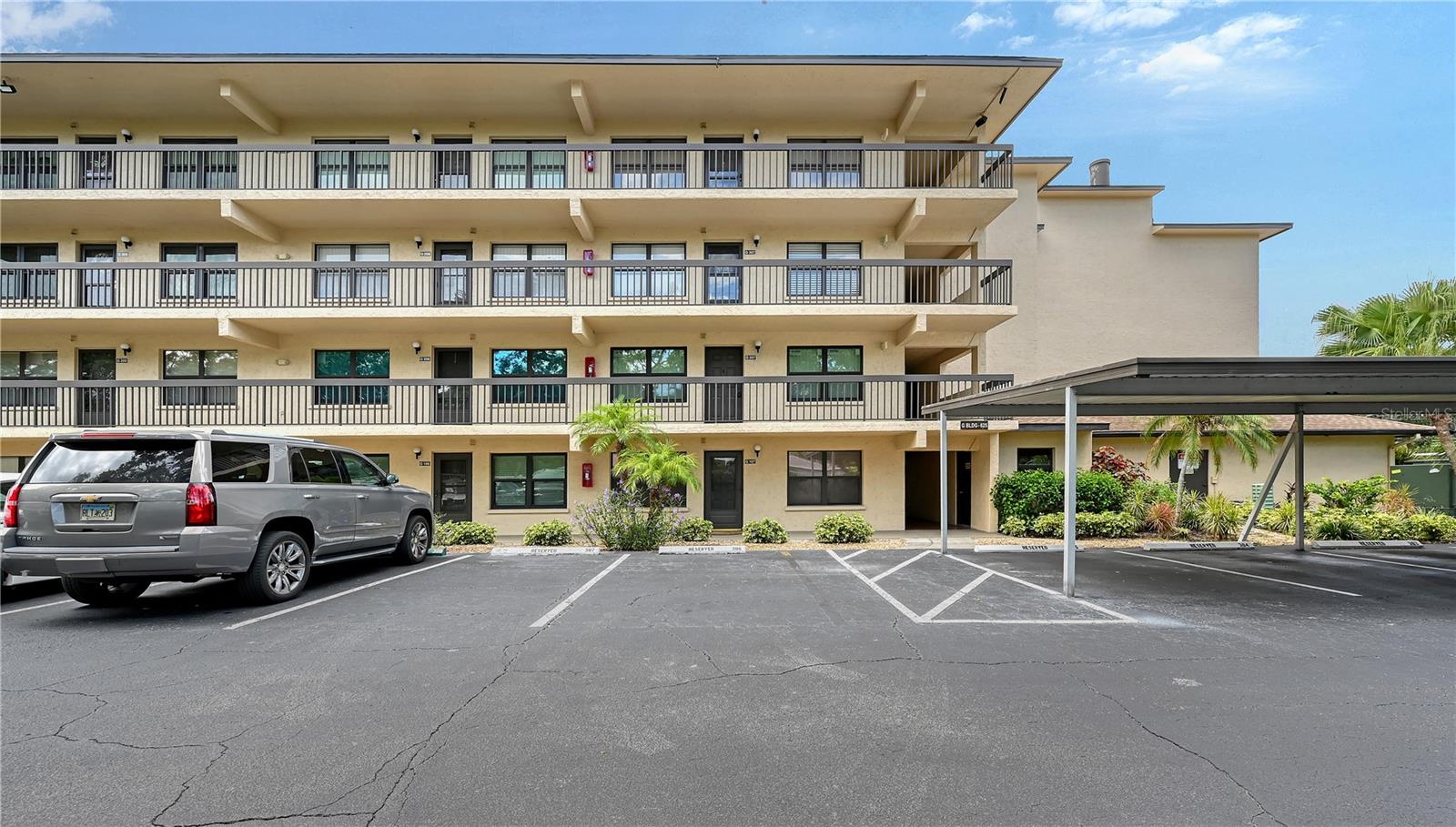 Welcome Home to this lovely, well-maintained first floor condo in 55+ community of Wood Park at Desoto Square in Bradenton! A stunning tropical oasis, Wood Park is a gated serene retreat with lush tropical landscaping and resort style amenities in the heart of central Bradenton. This first-floor residence is clean and bright, with a split bedroom plan and open concept living and dining spaces. The kitchen is fully equipped and features tons of storage in warm, wood-look cabinets and a cozy breakfast nook with open shelves. The secondary bedroom just off the entrance has its own bath and easy access to the stacked in-unit LAUNDRY closet! The living/dining rooms have gorgeous tile flooring and flow out to the screen enclosed balcony with storm windows and a breathtaking view of the pond, fountain, and mature tropical foliage. The primary suite is spacious and features a walk-in closet, and an en-suite bathroom with a tiled walk-in shower. This home is fully furnished and move-in ready so that you can start enjoying the Florida lifestyle you’ve imagined! Spend days cooling off at the community pool, have picnics by the lake, play shuffleboard on the grounds surrounded by gorgeous tropical trees and flowers, or join neighbors in the clubhouse for a workout or a game of pool. Anna Maria Island is just minutes away, and it's convenient to downtown Bradenton’s nightlife, Riverwalk and the new River Taxi to Anna Maria Island. LeCom Park is nearby for Bradenton Marauders games and Pittsburg Pirates spring training too! Call today to schedule your showing!