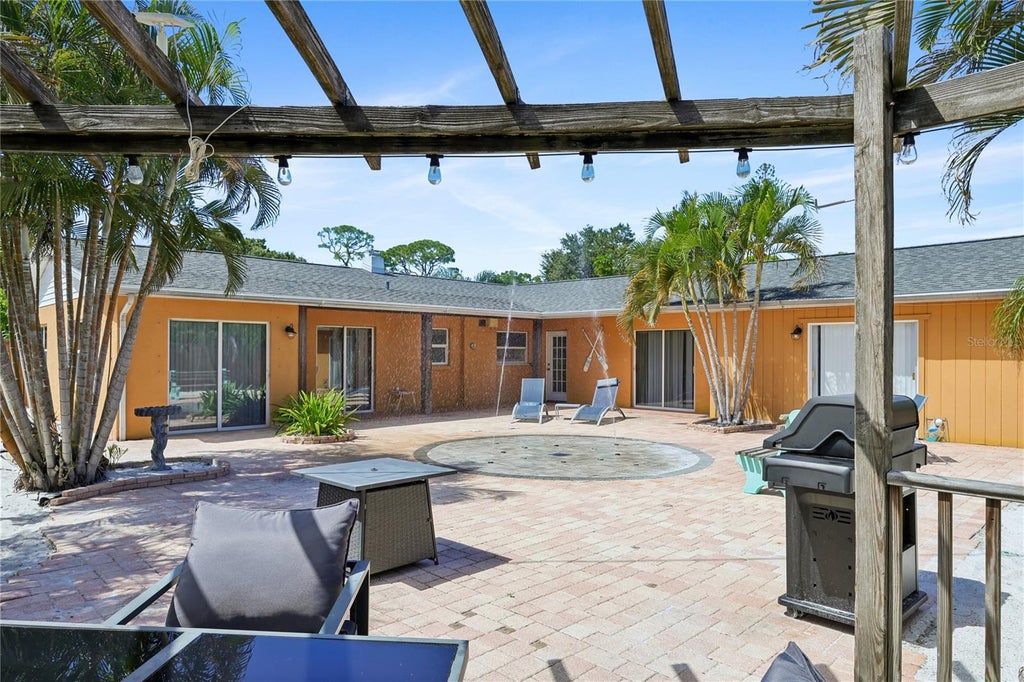 Photo of 8479 Pinewood Road, Sarasota, FL 34243 (MLS # A4707949)