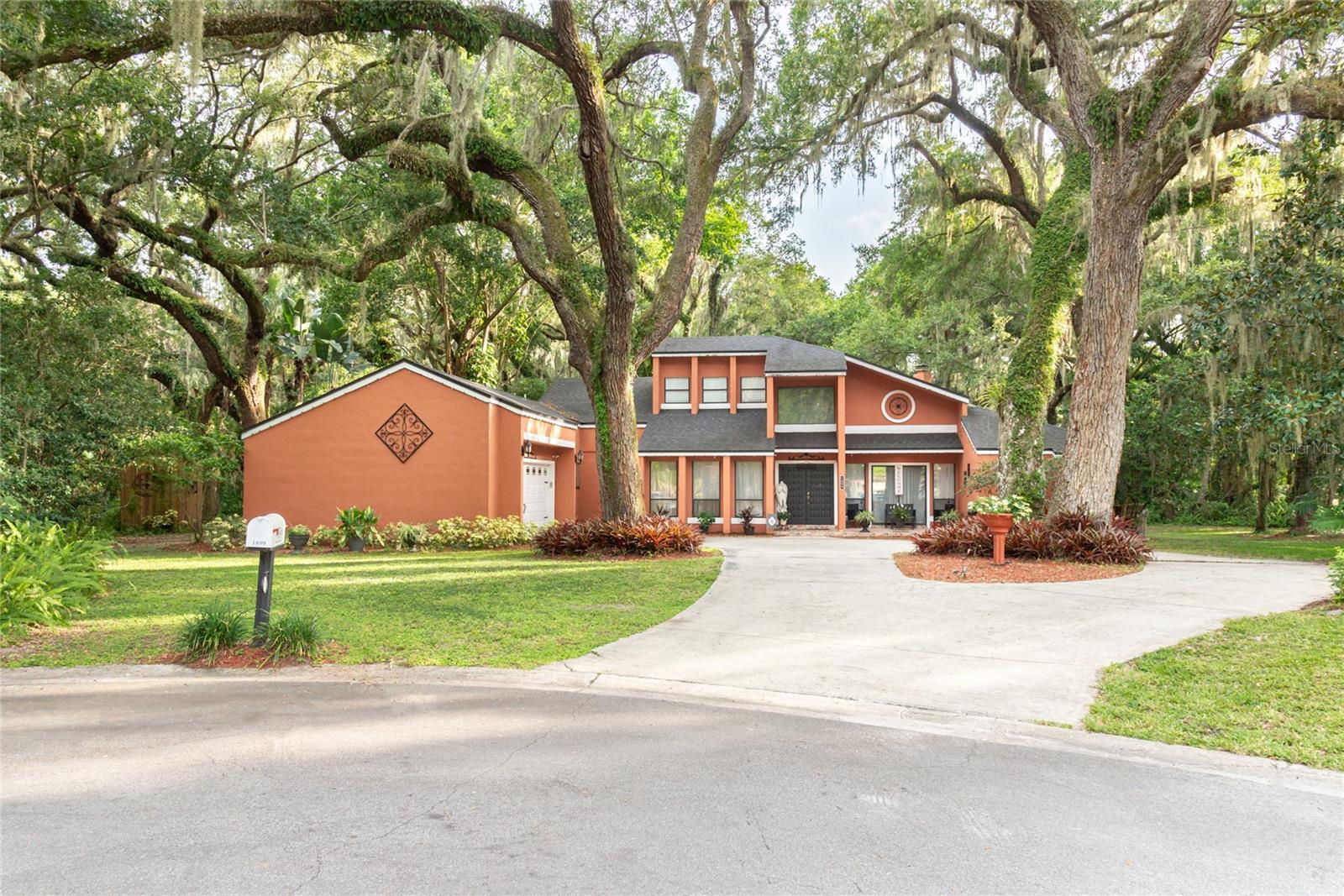 No HOA, No CDD! This custom-built home is packed with unique features and lots of charm. The moment you step inside, you’ll be captivated, the spacious formal living room with soaring ceilings, a cozy wood-burning fireplace. Separate formal dining room spacious for a large dining table, beautiful light fixture. The grand kitchen offers plenty of cabinet storage, a standard sink plus a bonus prep sink, a built-in oven, microwave, and a cooktop range with stainless steel appliances all included.
Prepare to be "WOWED" when you enter the expansive Florida room, bringing lots of natural light, this space offers endless possibilities or options, a countertop with sink, cabinets, perfect for when entertaining or gathering, an extra refrigerator. Right off the Florida room is a side bonus room that can make a great play room area, hobby, endless options. From here, enjoy access to the backyard and the screened-in porch where you can relax and take in the natural surroundings.
The master suite easily accommodates a king-sized bed and plenty other furnishings. The master bath is truly one-of-a-kind, experience a spa-like retreat with a sunken dual-head shower surrounded by nature-inspired design, dual sinks, a private water closet room with an additional sink, and a custom walk-in closet with custom built-ins.
The first floor also features a second bedroom and bathroom, while the 3rd bedroom Loft-style upstairs provides additional options to be used as a bedroom, office space or other.
This is a perfect home for entertaining and family gatherings, this home sits on nearly half an acre (.45) at the end of a cul-de-sac. Exterior highlights include a circular driveway, a shed, and lush greenery throughout. Bring your boat or RV—there’s plenty of room for both! Fantastic location, near the Kissimmee lakefront, minutes to the Turnpike, restaurants, shopping, 20 min to Airport, and much more. Home Sold As-Is, don't miss out on this opportunity to make this your home!!