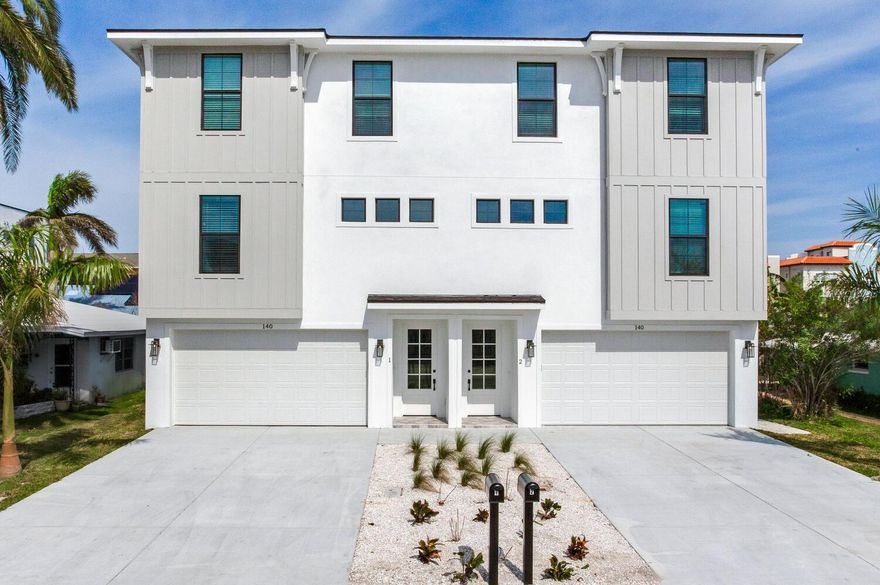 Steps from the shoreline, outdoor living takes center stage with multiple balconies for sunrise coffee and sunset unwinding, while an oversized garage parks up to four cars and still leaves space for a workshop, fitness zone, or media lounge. Inside, natural light and soaring ceilings open to a generous great room, where designer furnishings and layered décor set a polished coastal tone. The chef’s kitchen anchors the main level with premium appliances, custom cabinetry, and expansive prep surfaces that make entertaining effortless. A flexible four-bedroom plan includes a standout primary retreat with a grand double-door entry, private balcony, large walk-in closet, and a spa-inspired bath showcasing an expansive walk-in shower. Completed in 2024 with meticulous craftsmanship, every finish from flooring and fixtures to hardware and lighting was selected for durability and timeless style, creating a refined beachside haven of comfort and ease.