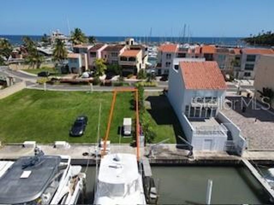 Prime Waterfront Lot with Dock – Build Your Dream Home! Discover the perfect canvas for your dream home on this 165.09 square meters flat lot with a private dock, ideal for boating enthusiasts. It comfortably accommodates a 55-60 feet boat, offering direct access to serene waters. Located in a gated community with a pool and access to all the amenities of Palmas del Mar, you can enjoy luxury living at its finest.
Related costs: CRIM: $ 83.96, Slip Boat Association: $ 85.00/ month, San Miguel Island Regime: $ 345.00/ Quarterly & Palmas Homeowners Association (PHA): $ 1014.00 / year. Some of the resort amenities are: over 15 restaurants within the Palmas community, community town center with shops, banks and spa facilities, Palmas Academy, Equestrian center, Yacht Club Marina, miles of walking and bike trails, over 3 miles of beaches, 24/7 private security, two 18 holes championship golf courses, tennis club and pickleball facilities and the Beach Club with direct access to the beach with its private restaurant. Don’t miss this rare opportunity! Contact us today for more information.