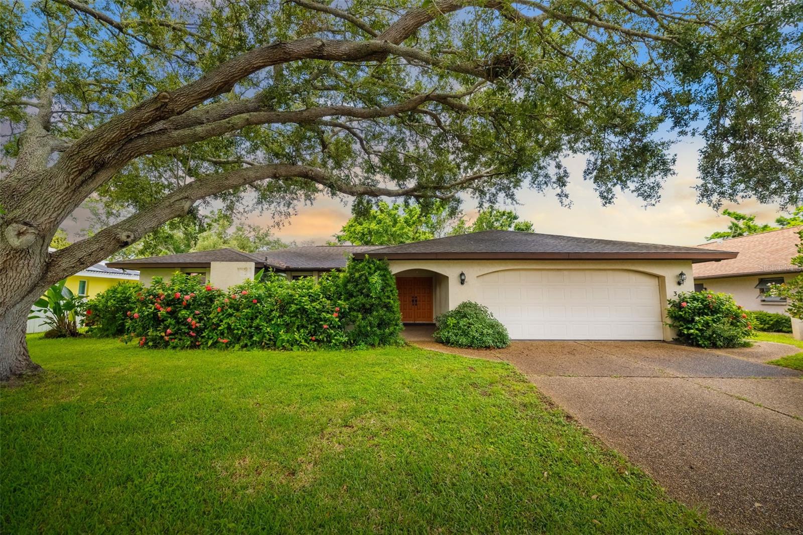 One or more photo(s) has been virtually staged. Welcome to this charming home in the deed-restricted Beneva Pines community, centrally located in one of the best school district Sarasota has to offer. This 2,000+ square foot gem offers a thoughtful split bedroom layout that provides both togetherness and privacy – perfect for families who love each other but also appreciate their personal space. This original Amon Shrock built home offers a clean slate for the price to make it all your own. Don't look around, this is the least expensive 3 Bedroom 2 bathroom with two garage in 34233.
The heart of this home lies in its stunning family room, featuring cathedral ceilings adorned with beautiful wood beams that draw your eyes upward in wonder. Built-in bookcases add character and functionality, while abundant windows flood the space with natural light throughout the day. The separate living room and dining room provide flexible entertaining options for both intimate gatherings and larger celebrations.
The extra-large primary bedroom includes an ensuite bathroom, creating a peaceful retreat at day's end. However, the true star of this show is the fully enclosed lanai – a serene sanctuary so inviting you might find yourself reluctant to venture back inside. Multiple access points from the primary bedroom, living room, and dining area make this outdoor oasis feel like a natural extension of your living space. Practical amenities include a spacious laundry room with extra storage and deep sink, plus a large two-car garage.
The Beneva Pines community offers excellent value with annual dues of just $350, maintaining this well-kept neighborhood that serves as one of Sarasota's hidden treasures. Location, Location, Location! Located minutes from world-famous Siesta Key Beach, zoned for the highly-rated Riverview School District, The Legacy Trail, hospitals, entertainment and even right between Bahia Vista, Gulf Gate Estates and Phillippi Estates. This home combines renovation potential with an unbeatable location near shopping, dining, and recreational opportunities. Book your showing today.