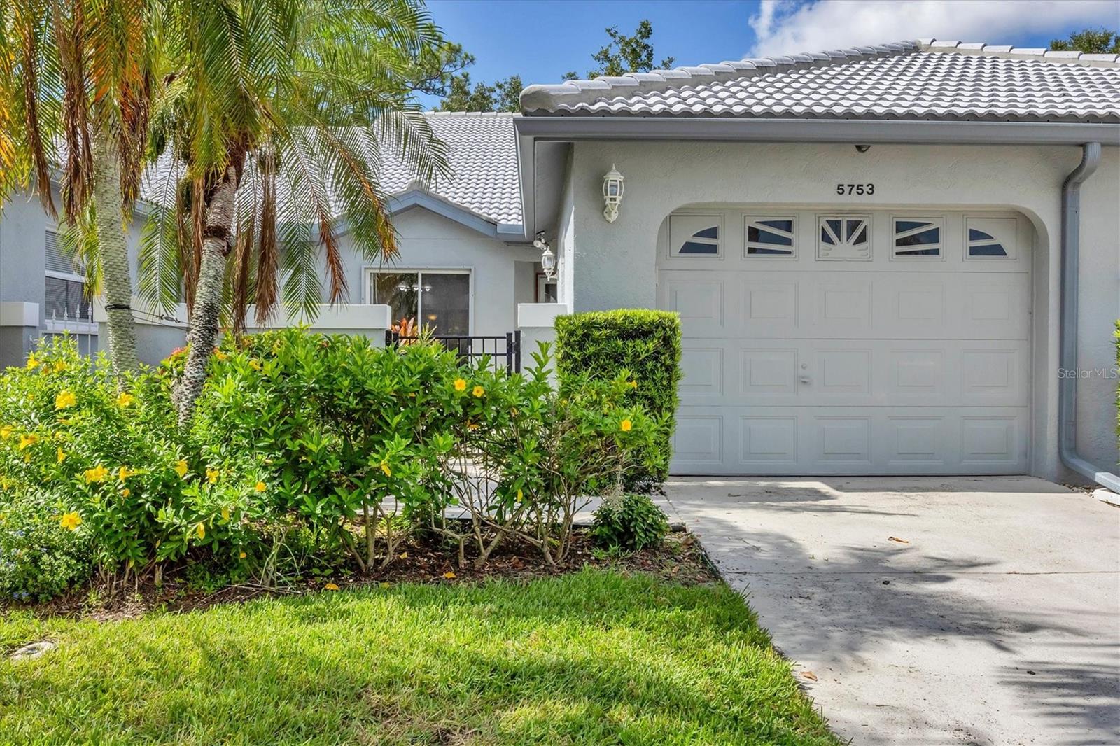 Welcome to Casa Del Sol—a charming and beautifully maintained villa community in the heart of Sarasota, where peaceful surroundings create a lifestyle that’s as comfortable as it is convenient.
This delightful 2-bedroom, 2-bath split-plan villa includes a versatile den/office, 1-car garage, and a host of thoughtful design features that set it apart. From the moment you arrive, you’ll love the private front courtyard entrance that adds warmth and curb appeal. Step inside to find a spacious kitchen with granite countertops, over-cabinet lighting, and a sunny eat-in dining nook—perfect for casual mornings or entertaining guests.
The living room features vaulted ceilings, built-in shelving, and a decorative lighted display shelf, creating a bright and welcoming atmosphere. Tucked just beyond, the Florida room offers serene preserve views, perfect for relaxing with a book or enjoying nature. Skylights in both the den and Florida room bring in beautiful natural light all day—this is one of the rare floor plans in Casa Del Sol that was originally designed by the builder with skylights.
Granite countertops carry through to both bathrooms, adding style and continuity, and the split-bedroom layout offers privacy for guests or family. Step out back to a quiet patio area ideal for grilling, outdoor dining, or simply soaking in the peaceful scenery.
As part of the Casa Del Sol community, you’ll enjoy community amenities designed for everyday enjoyment including a heated pool, clubhouse, tennis courts, and fitness center—all with maintenance-free living and a welcoming neighborhood atmosphere.
The location is outstanding with easy access to beaches, downtown charm, and nearby shops and dining—everything you need is just around the corner. Make this your next home—or your perfect home away from home! Seller is offering a one-year home warranty!