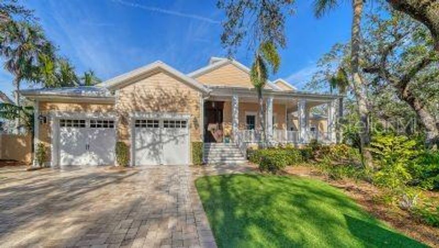 Majestic waterfront home nestled in one of Siesta Key's most exclusive neighborhoods. Prime waterfront location with direct access to the inter-coastal (no bridges) and features a 16,000 pound vertical lift and a jet ski lift. This Waterfront home features wraparound decks on multiple levels composed of Brazilian Ipe decking, wood ceilings, a private grill area with a dramatic view up the canal and a resort like swimming pool and spa featuring a rock waterfall and paver patio to fill your sun filled afternoons. Upon entering the home, you will see the amount of detail and craftsmanship that was put into this home. Hand-scraped wood flooring, coffered tongue-n-groove ceilings, huge baseboard and crown molding throughout. Expansive windows let the natural light in and an aquarium glass wall in the kitchen/family room overlooks your lower deck, swimming pool, spa and water view. The home has well over 6000 square feet of living area with the master suite occupying the first-floor level. This home affords 6 bedrooms, 5 full baths, 2 half baths, a private office with built-in cabinetry, 2 wet bars one on each level, 2 laundries with one on each level, a Sports room/ man cave with a built-in entertainment center. Upstairs has 4 bedrooms, two of which are suites, a second family room/playroom, theater/entertainment room which connects to your second level deck. The main level of the home incorporates your kitchen, family room, pantry, wet bar, dining room, private office, master suite and laundry. The kitchen features a huge walk-in pantry with entry door, a huge center island with a granite top, Subzero refrigerator, a Wolf 6 burner/griddle stove, a Wolf warming drawer, a Wolf microwave, 2 drawer Fisher Paykel dishwasher and a second Miele dishwasher for all your entertainment needs. Each level has a wet bar with the lower level having a subzero wine refrigerator and a drink refrigerator and the upstairs level has a Fisher Paykel dishwasher, an ice-maker, microwave, and a refrigerator. For the car enthusiast you have two 2 car garages with separate drives which provides additional parking as well. This spectacular home is hard to match, and you won't be disappointed. The home has an elevation of 15 feet and also has a home generator to provide comfort and a sense of security during any power outages that may occur. Schedule an appointment to see your future home!