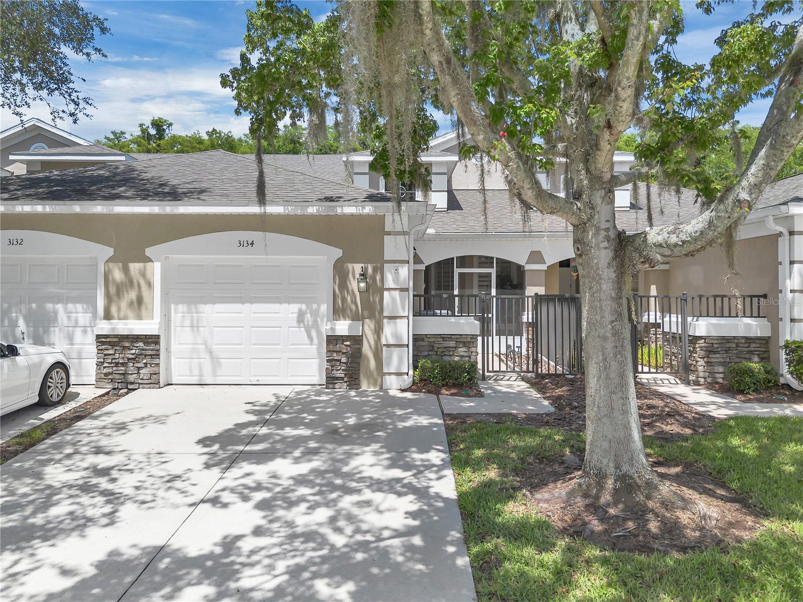 Welcome to 3134 River Branch Cir, a well-maintained and move-in-ready townhouse located in the gated community of Reflections at Storey Lake in Kissimmee. This 2-bedroom, 2-bathroom home features a functional layout with defined living and dining spaces, high ceilings, and modern porcelain tile flooring installed in 2023.
In addition to the two bedrooms, there’s a flex room currently used as a home office or den, which can be easily converted into a third bedroom without major renovation—adding value and versatility for growing families or guests. The kitchen is spacious and practical, offering plenty of storage and room for a dining table, with direct flow into the main living areas.
Enjoy year-round comfort in the air-conditioned Florida Room, plus the privacy of a screened front porch and fenced entryway. You'll love the quiet setting with no rear neighbors, as the home backs onto a green area owned and maintained by the HOA.
Additional features include a roof replaced in 2018, water heater from 2022, and an A/C unit in good condition. The home also boasts newer toilets, a newer kitchen sink, custom blinds throughout (valued at \$7,000), added shelving in all closets, and a garage with extra storage space.
Residents enjoy access to a community pool, tennis courts, and walking paths, all within a secure, gated neighborhood. The HOA covers exterior maintenance for a low-hassle lifestyle.
The location is exceptional—just 3 minutes to The Loop shopping center, with dining, retail, and entertainment at your fingertips. You're also only 20 minutes from Orlando International Airport, 20 minutes to Magic Kingdom, and 30 minutes to Universal Studios, making this an ideal home for commuters, vacationers, or investors.
Don’t miss the opportunity to own this flexible and well-located home in the heart of Central Florida.