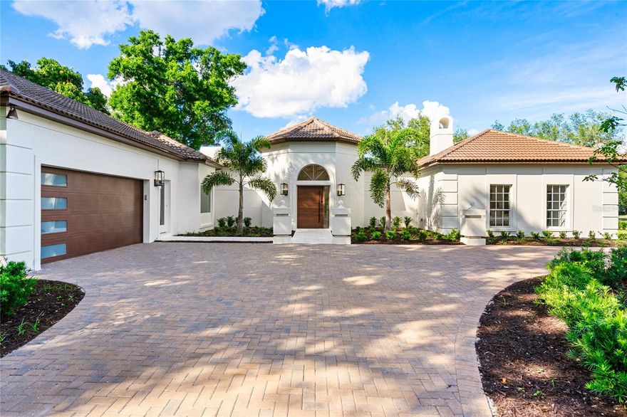 Welcome home - to this stunning luxury estate located in the heart of one of the most sought-after guard-gated neighborhoods in Central Florida - Isleworth Golf & Country Club. This magnificent estate offers the perfect combination of privacy and grandeur, with every detail crafted to ensure the best in luxury living. As you enter over the travertine walkway and proceed through the custom front door to the grand foyer, you will be greeted by a spectacular and professionally designed split yet open-plan living area, featuring natural wood floors, updated gourmet kitchen with Monogram appliances, a gas oven, a courtyard pool featuring a french travertine deck, luxury finishes throughout, and windows that flood the space with natural light. The spacious living room is perfect for entertaining guests, with stunning views of the pool and newly updated landscaping. The three en-suite bedrooms with private bathrooms combined with a private office make this a great luxury living option for a family of any size. Isleworth Golf & Country Club is known as a highly exclusive community and Country Club neighborhood in Windermere - known for luxury living and its famed chain of lakes. Isleworth Golf and Country Club Memberships are available at additional cost - offering club amenities such as golf, clubhouse, a fitness center, pool, and social events. Don't miss this opportunity - inquire today for a private tour. Additional note: All furniture available for sale separately.