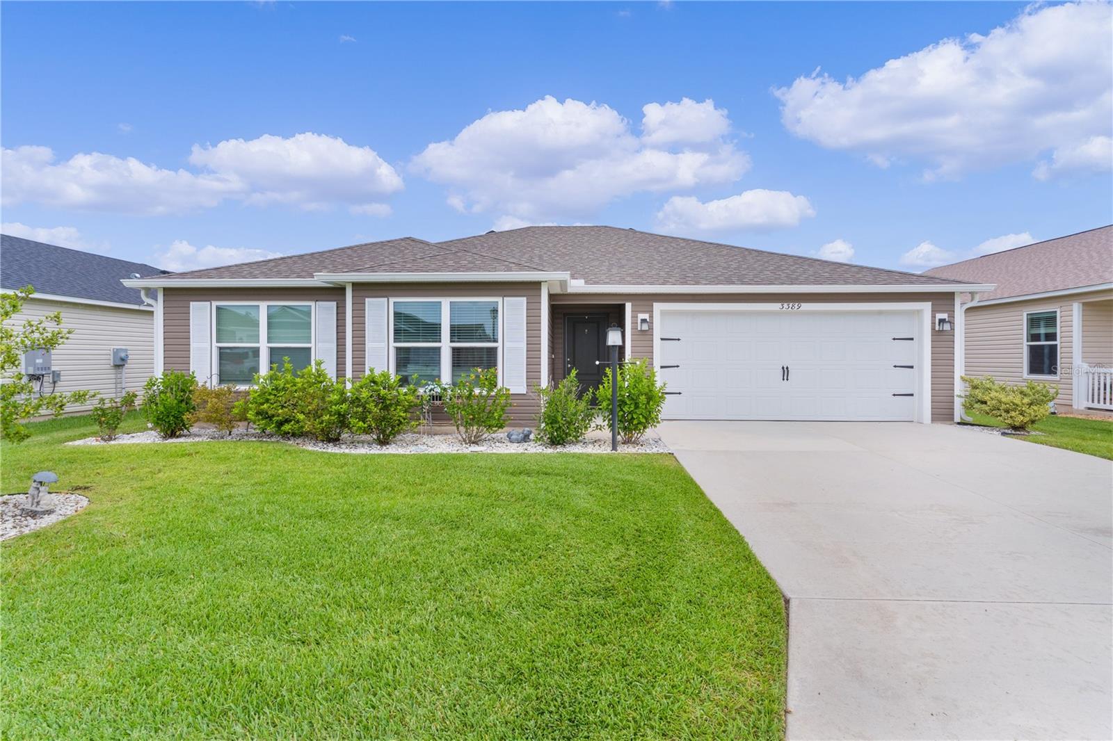 Welcome to this stunning Anchor Cottage model home located in the highly sought-after Village of DeLuna in The Villages, Florida! This beautifully maintained 3 bedroom, 2 bath residence blends style, functionality, and comfort, making it the perfect place to enjoy Florida living at its finest.
From the moment you step inside, you'll appreciate the thoughtful upgrades and fresh, modern aesthetic. Elegant wall detailing, fresh paint, and high-definition countertops create a designer look throughout the home. The open-concept kitchen boasts crisp white cabinetry, stainless steel appliances and a gas stove. The home is equipped with a tankless hot water heater that ensures those endless showers stay toasty warm for you.
The spacious primary suite offers comfort and privacy, while two additional bedrooms provide flexibility for guests or hobbies. The 2-car garage offers ample space for vehicles and storage. Step outside to enjoy the large screened-in lanai, ideal for relaxing or entertaining in the peaceful Florida evenings.
Furniture, décor, and appliances are available separately, offering the opportunity to move right in or personalize to your taste.
Conveniently located near bridges, trails, and The Villages' newest amenities, this gem in DeLuna is ready to welcome you home. Schedule your private tour today!
