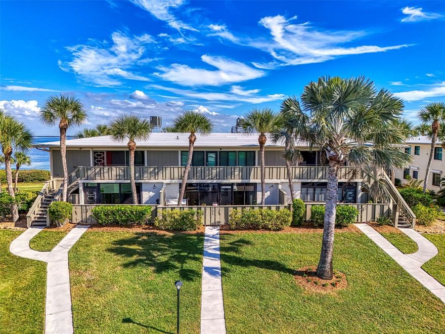 Welcome to your slice of paradise in Westbay Point & Moorings! This rare FIRST FLOOR bayfront condo offers spectacular water views of Anna Maria Sound from most rooms, creating the perfect backdrop for coastal living. This community is located on the highest part of Anna Maria Island and has no flooding history.

This spacious residence features two large bedrooms including a primary suite with a private bath and a generous walk-in closet. The open-concept kitchen flows seamlessly into the great room and the large bonus room, perfect for entertaining, relaxing, or working from home. A closet pantry adds convenient storage for your culinary essentials. Recent upgrades bring peace of mind and modern comfort new electrical panel, new hot water heater, and new stainless steel dishwasher, microwave, stove, and ceiling fan. Air conditioner was replaced in 2018. What truly sets this home apart is the air-conditioned laundry room inside (not common in all units) and the spacious bonus room with endless possibilities.

Enjoy two private outdoor spaces: the fenced front courtyard, ideal for dining al fresco or nurturing your favorite plants and flowers, and the back patio, where you can unwind while watching boats glide by and the Skyway Bridge light up the night sky.

Westbay Point & Moorings is a sought-after waterfront community offering heated pools, tennis courts, and boat slips. Just around the corner, you’ll find the Holmes Beach public boat ramp as well as pickleball, basketball, fitness, dog, and skate parks, plus the local library. Shopping, dining, and the sugar-sand beaches of Anna Maria Island are all less than a 10-minute drive away. This home is offered UNFURNISHED ready for you to bring your personal touch and start living the coastal lifestyle you’ve been dreaming of. Come see why this bayfront gem stands out from the rest—comfort, convenience, and captivating views await at Westbay Point & Moorings.