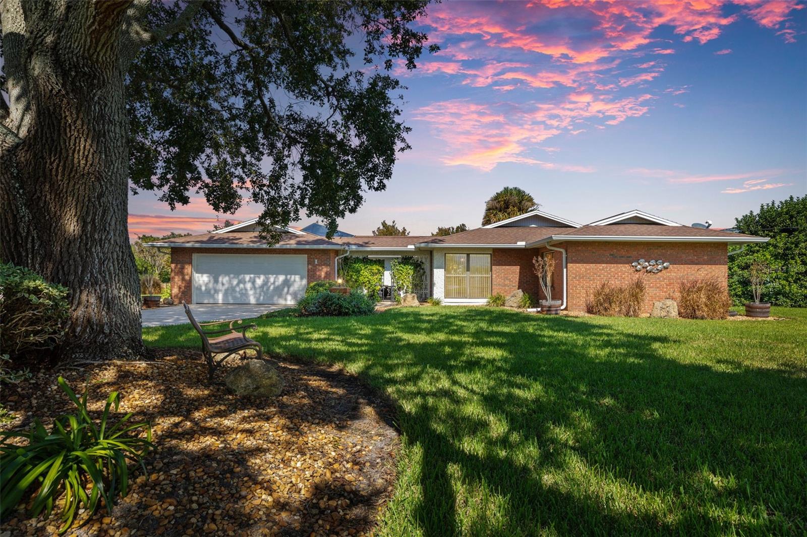 On Over Half an Acre of Pristine Canal-Front Property
A truly rare opportunity in the heart of Palm Coast! This exceptional canal-front residence offers over 2,300 sq ft of beautifully designed living space, plus an addtional enclosed 273 sq ft patio over looking a sparkling pool, all perfectly positioned on an expansive .56-acre end corner lot boasting 189 feet of premier saltwater frontage—ideal for a custom dock or serious boating enthusiast.
Enter through the charming gated courtyard to your own private oasis featuring a newer heated pool and spa, screened lanai, and breathtaking wide canal views. Inside, you’ll fall in love with the modern, updated kitchen adorned with soft-close cabinetry, gleaming quartz countertops, stainless steel appliances, and elegant tile flooring flowing throughout the home. Additional highlights include an oversized garage, a large, bright laundry room, and a fully electric workshop retreat all tucked away on the lush grounds—perfect for storage.
Offering unmatched privacy, space, and serene water views, this home captures the essence of coastal living—all just minutes from the Intracoastal Waterway, marina, shopping, dining, and Palm Coast’s pristine beaches.