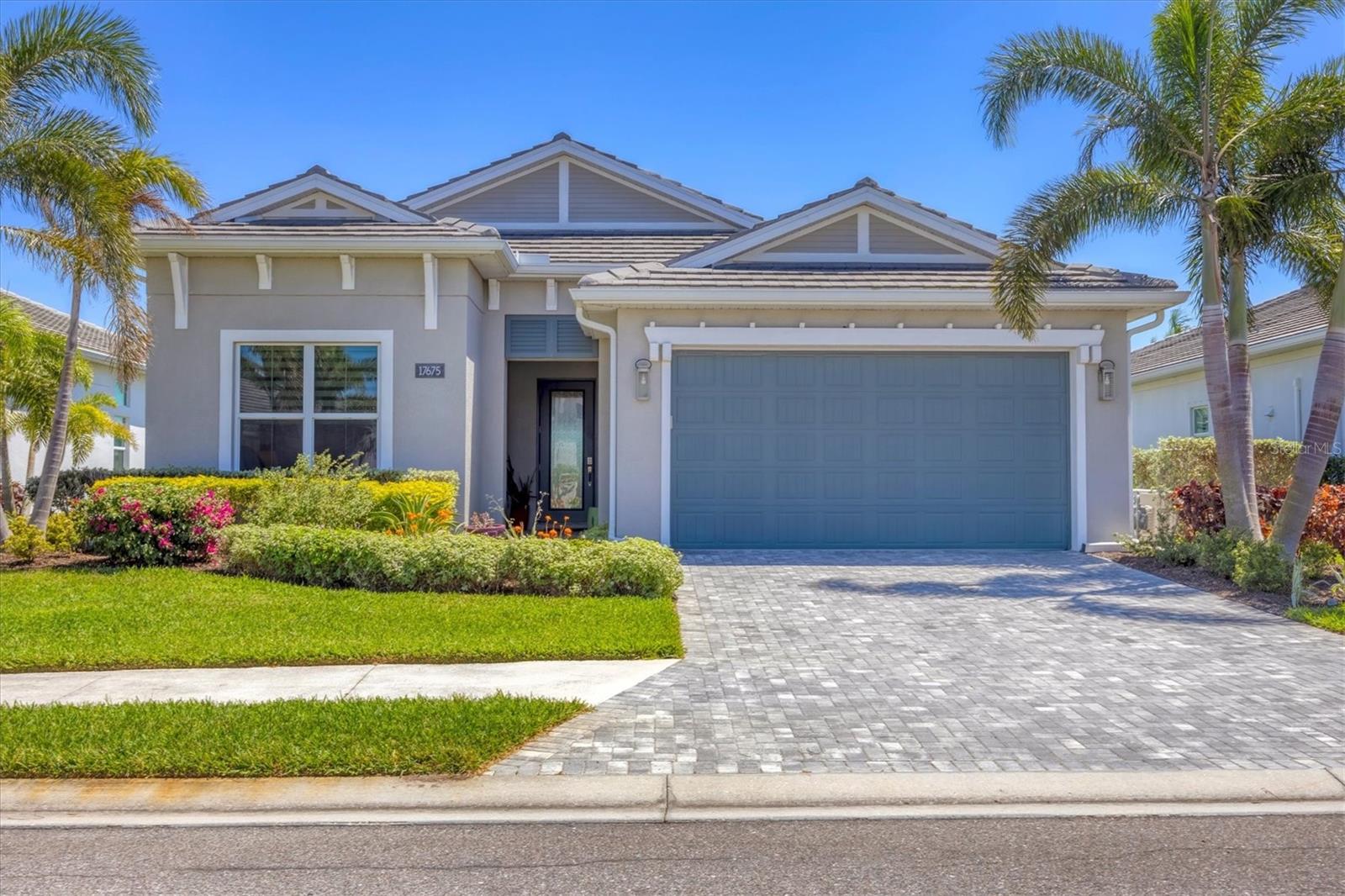 This home lives LARGER than the square footage reflects with its 3 bedrooms plus office/den and 3 full baths. Located on a quiet interior lot with views of the nature preserve, you’ll enjoy the privacy of no-back neighbors and the bonus of amazing bird watching. Upon entering the property, you’ll be delighted to experience all the thoughtful upgrades and updates chosen by the seller to reflect a stunning palette and smart choice of classic appointments. Three bedrooms and three baths with an office/den provide space, privacy for guests and an open flow that is critical to Florida living. The heated saltwater pool and caged lanai are expansive and provide wonderful outdoor entertaining. The cook’s kitchen boasts an oversized island with a unique “leather” finish Dolomite countertop, upgraded cabinets and backsplash. Extra storage under the island and high-end Jenn-Aire appliances including 2 ovens, make meal prep easy and fun. Additional noteworthy features include: a whole house gas generator with its own surge protection and an additional surge protector dedicated to the home, upgraded floor tile throughout, high-end ceiling fans, hurricane protection on all openings including Kevlar automated hurricane shades on the lanai, 3M sun protection film, customized Hunter Douglas window shades, custom closets, upgraded lighting, faucets and hardware throughout. The garage boasts a 4’ extension, epoxy flooring, insulated garage door, electric car charger, and attic storage with pull down stairs. …too many upgrades to mention. This property is perfect for empty nesters and seasonal owners, singles and young couples who want to live in an exceptional neighborhood without the burden of a huge house. Enjoy the walking trails, clubhouse with fitness, tennis and pickleball courts, close to UTC Mall and a myriad of shops and restaurants. You have it all…right here!