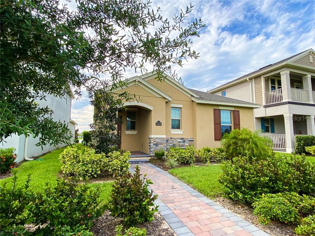 Beautiful and well-maintained 3-bedroom, 2.5-bath home located in the highly sought-after Waterleigh community. Enjoy watching the Disney fireworks right from the front of your home! This open-concept floor plan features a spacious kitchen, dining, and living room combination. The kitchen offers 42-inch cabinets, stainless steel appliances, and a large island with a breakfast bar. The primary suite is conveniently located on the first floor and includes a double-sink vanity and generous storage space. Upstairs, you’ll find two spacious bedrooms, a full bath, and a large loft area—perfect for a family room or office. Tile flooring throughout the main level and carpet upstairs. Laundry room includes a new washer and dryer. The home also offers a rear-entry two-car garage off Brisk Breeze Alley. Residents of Waterleigh enjoy HOA-provided lawn care and resort-style amenities including two community pools, a fitness center, tennis and volleyball courts, mini-golf, and more. Conveniently located just minutes from Disney, Hwy 429, and Hamlin Town Center.