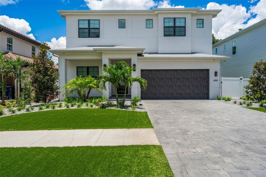Introducing an Exceptional Coastal Contemporary Masterpiece in South Tampa. Nestled within the vibrant South Tampa community, this exquisite recently constructed home offers the perfect blend of luxury and modern living. Boasting an open-concept design, this 5-bedroom, 5.5-bath residence is thoughtfully designed for both comfort and style, making it an ideal sanctuary for discerning homeowners. Upon entering the home, you are welcomed by an inviting foyer that sets the stage for what lies ahead. The first floor features a spacious guest suite, providing a comfortable space for family and friends. The grand living room is designed for relaxation and entertainment, while the Chef's kitchen is a culinary masterpiece, featuring top-of-the-line Wolf and JennAir appliances, granite countertops, solid wood cabinetry, an eat-in breakfast bar, and a separate dining area. One of the highlights of this home is the enviable mudroom and pool bath, adding convenience to your daily routine. Step outside to discover the stunning saltwater pool and spa, surrounded by a travertine patio and outdoor turf with two outdoor fire pits, perfect for lounging and outdoor gatherings. The 2-car garage offers ample storage space for your vehicles and belongings. Upstairs, the owner's retreat is a true haven, complete with an elegant bath featuring dual vanities, a pass-through shower, a luxurious soaking tub, and a spacious walk-in closet. Three additional bedrooms, each with its own en suite bath, provide privacy and comfort for every member of the family. The generously sized laundry room on the second floor adds practicality to your daily life. This home is tastefully appointed with 7.5" Naturally Aged Medallion Collection "Playa" oak flooring, 7" crown molding, insulated Low-E impact glass windows, Level 5 drywall finish on walls and ceilings, 2 tankless water heaters, and solid core doors throughout. Additional upgrades since the owner’s purchase includes a custom gazebo, outdoor turf, a home gym, a top of the line security system that covers the perimeter of the house and front door, WiFi hotspots throughout the entire house inside and out, wireless connection to a house-wide speaker system set up for music and tv, and an entire audio visual system installed throughout the home. TVs and AV system included with current pricing. Conveniently located just minutes from Downtown Tampa, Tampa International Airport (TIA), Hyde Park, restaurants, shopping, and sporting venues, this home offers the perfect blend of tranquility and accessibility. Don't miss the opportunity to make this Coastal Contemporary dream home your own and experience the best of South Tampa living with this exceptional property.