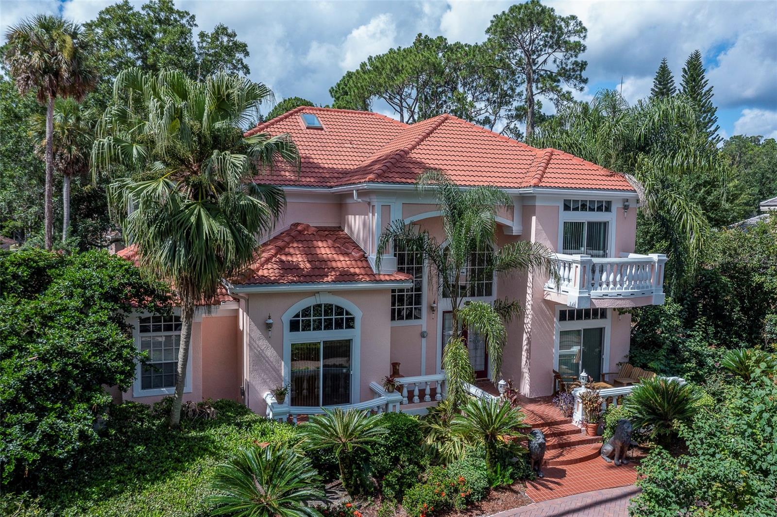 One of the only homes in Lake Forest with a front water view! This premier Seminole County guard gated community is known for its resort style amenities and tree lined streets. With 5 bedrooms, office and two bonus areas, this property is very versatile. Over garage bedroom, bonus/billiard room with kitchenette/bar and wine closet serves as a fantastic in-law suite or could also be guest or teen quarters. Primary bedroom is downstairs with a fully remodeled primary bathroom including garden style jetted tub, decorative sinks and 3 closets! Remaining bedrooms are upstairs (two on one side with a Jack/Jill bath with separate vanities on each side, one on the other side of bonus space with an ensuite bathroom and balcony). TILE ROOF replaced 2021, AC’s replaced within last 5 years. Enjoy year round entertaining with large, screened lanai, oversized pool/spa and sauna. Newer paver circular drive and side driveway to 3 car garage. Available furnished or unfurnished. Lake Forest offers a 24-hr guard-gated entry with numerous amenities: 10,000 sq ft clubhouse w/ newly remodeled fitness center, Jr. Olympic-sized swimming pool, heated spa, kiddie pool, playground, 55-acre private spring-fed lake, fishing pier, new lighted tennis and pickleball courts & a sports court. The community has been designated as a National Wildlife Habitat and has a newly added butterfly/pollinator garden. Lake Forest is zoned for Seminole County schools and is close to beaches, attractions and all that Central Florida has to offer! Easy access to I-4, 417 and 429.