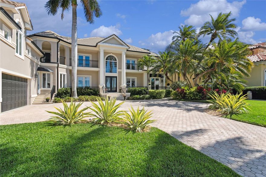 Under contract-accepting backup offers. A front gated entry takes you to this pristine Snell Isle waterfront home overlooking the sparkling waters of Tampa Bay. Upon entering the light-filled two-story foyer of this custom home you are greeted by a grand staircase surrounded by elegant and spacious living and dining rooms. This beautifully updated four-bedroom, four-and-a-half-bath home boasts a gourmet kitchen with custom wood cabinets, stone countertops, and a new gas cooktop. The eat-in kitchen has a walk-in pantry and opens to the family room which is adorned with a gas fireplace. Upstairs houses a spacious master bedroom and two additional bedrooms with ensuite baths all with equally stunning views of Coffee Pot Bayou. A bonus/game room, also on the second floor accessible with a separate staircase is perfect for gathering with family and friends. The exterior of this meticulously cared-for home includes a private backyard with a lovely heated pool and spa surrounded by lush, tropical landscaping. Across the street is the deeded deep, protected water lot with a new 63-foot-long dock and a 13000 lb boat lift with 100 AMPs of power. This amazing home is a must-see, and is just a ten-minute walk to all that downtown St. Petersburg has to offer! Buyer to verify all square footage.