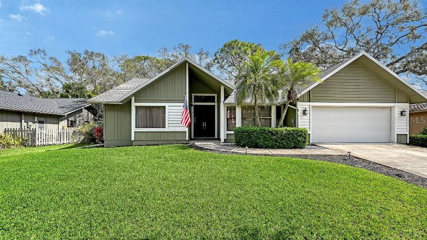 Welcome home to this meticulously updated and maintained 3-bedroom, 2-bath home in the charming, tree-canopied neighborhood of Woodland Park. Enjoy the comfort and sophistication of open space living, vaulted ceilings, custom library, a dazzling living room with wood-burning fireplace, and custom features throughout. Open all the sliders and bring the outside in or relax in a large, screened lanai with pool/spa and lots of lush privacy. Upgrades include porcelain tiled floors, new roof in 2020, irrigation system, quartz countertops, updated appliances, fixtures, renovated bathrooms, and pool heater. Located near shopping, restaurants & easy access to I-75.