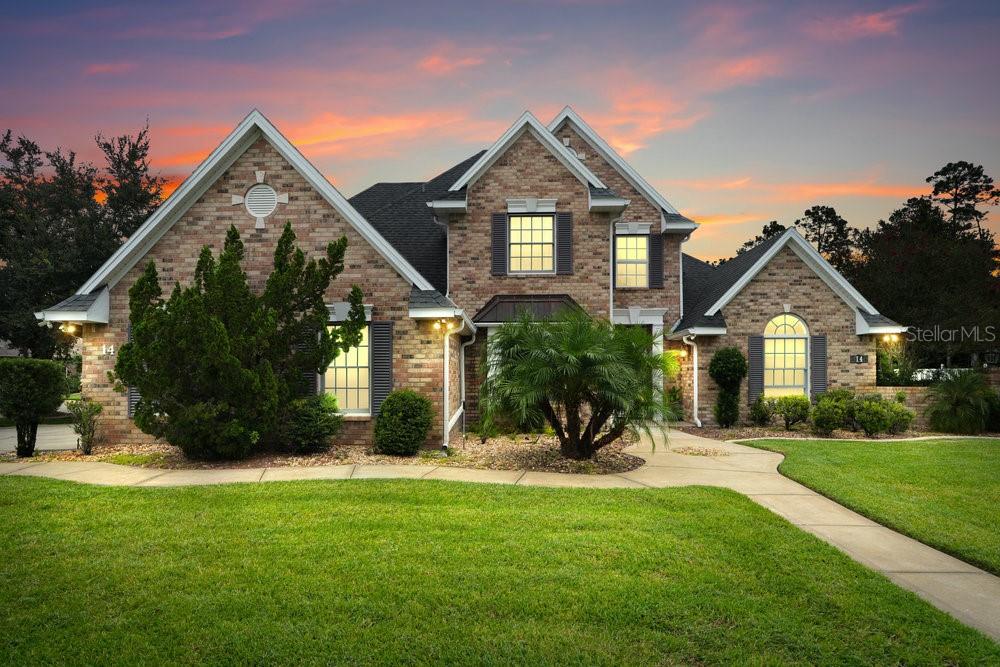 Welcome to this stunning custom-built brick home on a beautifully landscaped corner cul-de-sac lot in the desirable and quiet Hunters Ridge neighborhood of Ormond Beach. Featuring 4 bedrooms, 2.5 baths, 3,097 total square footage. The home has an oversized 2-car garage with a spacious walk-in storage closet, this residence was designed with quality and comfort in mind. The thoughtful layout includes two bedrooms on the main level, including the primary suite, while upstairs you'll find an impressive private suite with two closets—one full master-style closet and an intimate organizing closet—along with another large bedroom featuring its own oversized closet and generous space. Enjoy the open feel of volume ceilings, a bright eat-in kitchen with an oversized countertop, additional cabinet storage, and a large adjacent coffee bar, plus the convenience of an interior laundry room.
The home has been extensively updated with a new roof (2023), recently updated water heater, two updated A/C units and air handlers, and premium double-hung, impact-rated encased windows with thick material screens for both safety and energy efficiency. Above the garage, a well-built room provides excellent extra storage or potential hobby space. This home is set on a large lot with a very private fence, offering the comfort and convenience of privacy and quiet living spaces rarely found in today's market. Additional highlights include bonus attic storage, manicured landscaping, and beautiful curb appeal. Built in 2000, this home combines the strength of solid construction with modern upgrades all nestled within a peaceful cul-de-sac in a quiet, established neighborhood. The home boasts amazing space inside and out with very mature lush and mature trees. Best home in the area inside and out. A must see to appreciate.