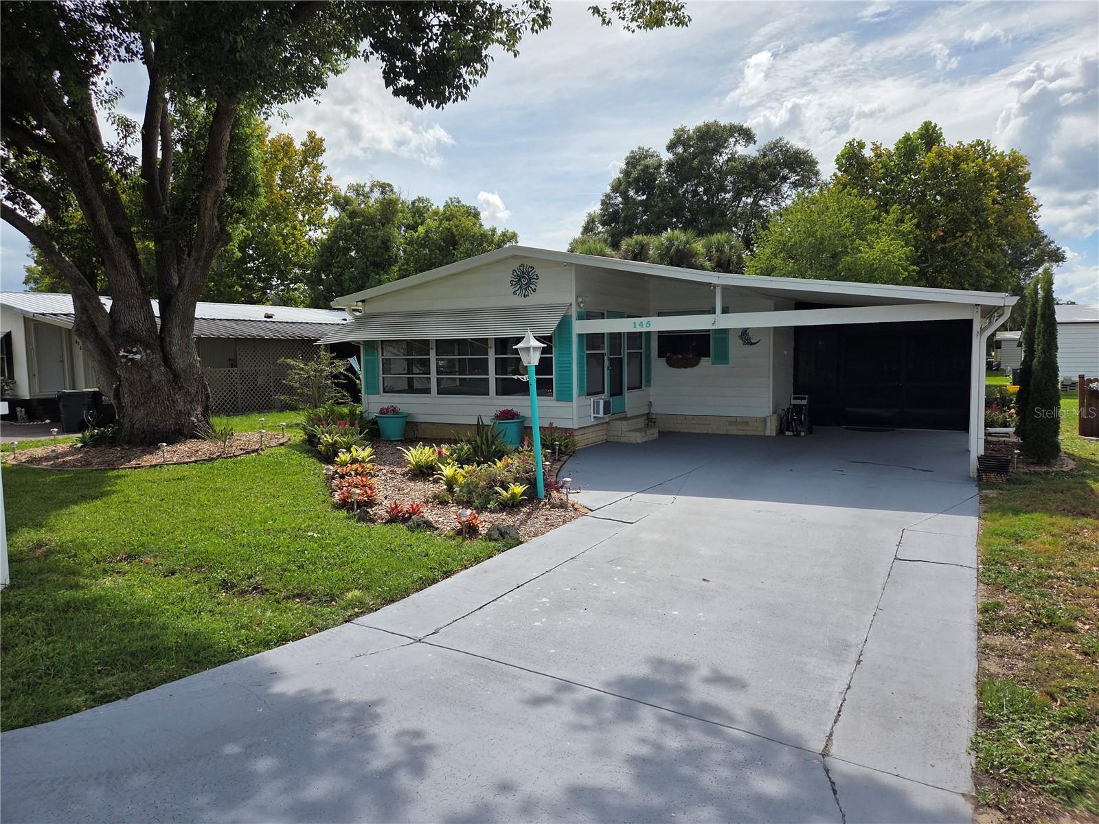 Beautiful 2 bedroom 2 bath home in Polo Park. Polo Park is a 55+ community located only 6 miles to Disney. This home has been updated from the roof to the plumbing. Both bedrooms have cedar closets. Both bathrooms have walk in showers and updated vanities. The kitchen offers all newer appliances. There is a lanai off the Living Room and a Screen Room off the kitchen. The laundry room is conveniently located off the screen room. The roof was replaced in 2024 with a membrane roof with a transferable warranty to the new owners. The piping in the house was all replaced in 2024 as well.