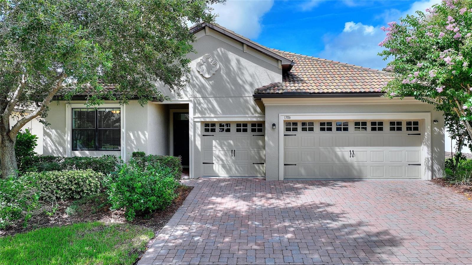 FULL GOLF & TENNIS MEMBERSHIP INCLUDED with your HOA! UPGRADES GALORE! Live like a champion in this impeccably upgraded 4-bedroom, 3-bath home with a spacious 3-car garage, perfectly situated in the highly desirable Phase 1 of ChampionsGate Country Club! Designed for effortless living and entertaining, this move-in-ready home boasts an open-concept layout with high-end finishes throughout, including granite countertops, 42” solid wood cabinets, with brand-new crown molding, chair rail accents, baseboards, and gorgeous flooring. Freshly painted inside and out, with brand-new energy-efficient windows, new gutters with leaf guard, and lush professional landscaping that elevates the curb appeal. Enjoy breathtaking sunsets from your expansive west-facing screened lanai, or retreat to the luxurious primary suite featuring dual vanities, a soaking tub, and a walk-in shower. Enjoy rocket launches, hot air balloons and fireworks right from your spacious east facing driveway! Just steps from the golf course, The Plaza, and the world-class Oasis Club—a private 14,000+ sq ft clubhouse offering a restaurant, bar, lazy river, movie theater, water slide, fitness center, game room, and more. You'll also have exclusive access to The Plaza’s private clubhouse (with a $75/month food credit), pickleball courts, two additional pools, a second fitness center, and the all-new Retreat Club with a full water park. The HOA covers all of this, plus lawn care, gated security, cable, high-speed internet, phone—and the CDD and trash are included in your taxes! Just minutes from Orlando’s world-renowned theme parks, shopping, dining, and major highways, this home is the ultimate blend of luxury, convenience, and resort-style living. Opportunities like this are rare—schedule your private showing today!
