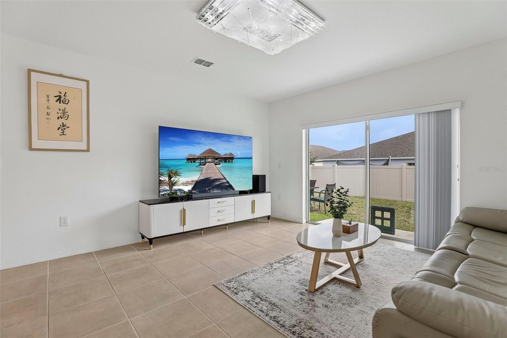 Photo of 5615 Costa Blanca Way, Davenport, FL 33897 (MLS # O6410948)