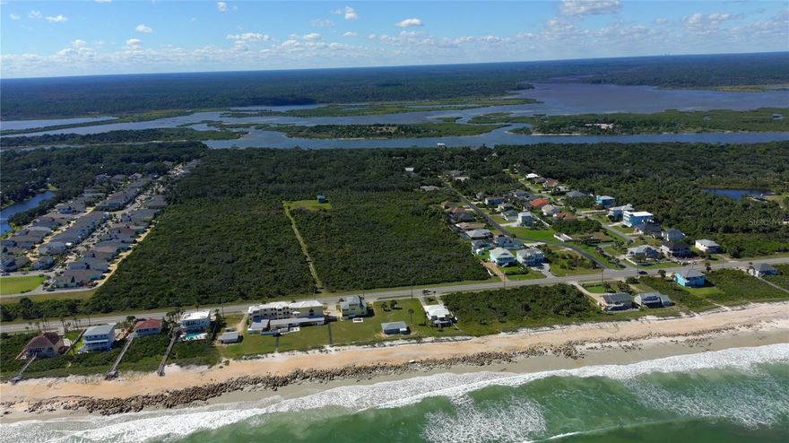 Exceptional Oceanfront AND Intracoastal Community Development opportunity!  18.6 + or - Acres.  This piece (9.9 acres) is priced to include the similar abutting parcel (9.7 acres) directly north of it.  BOTH PARCELS MUST BE SOLD TOGETHER.  Each Western parcel includes over 160' of Intracoastal Frontage with roughly over 2550' of depth between A1A and the Intracoastal.  Each parcel also includes a direct oceanfront lot of approximately 250' depth by 75' on the Atlantic.  So, combined lots are roughly 320' by 2550' on west side of A1A and 150' by 250' oceanside.  The property should support the development of two oceanfront homes and two sites on the Intracoastal, with approximately 54 TO 56 sites between them.  Successful ocean" community developments are already established on adjoining developed parcel to the north and in the general area.  THE COMBINED PARCELS SUCCESSFULLY UNDERWENT PRELIMINARY TESTING AND FLUM APPROVAL FOR A 56 UNIT SUBDIVISION.