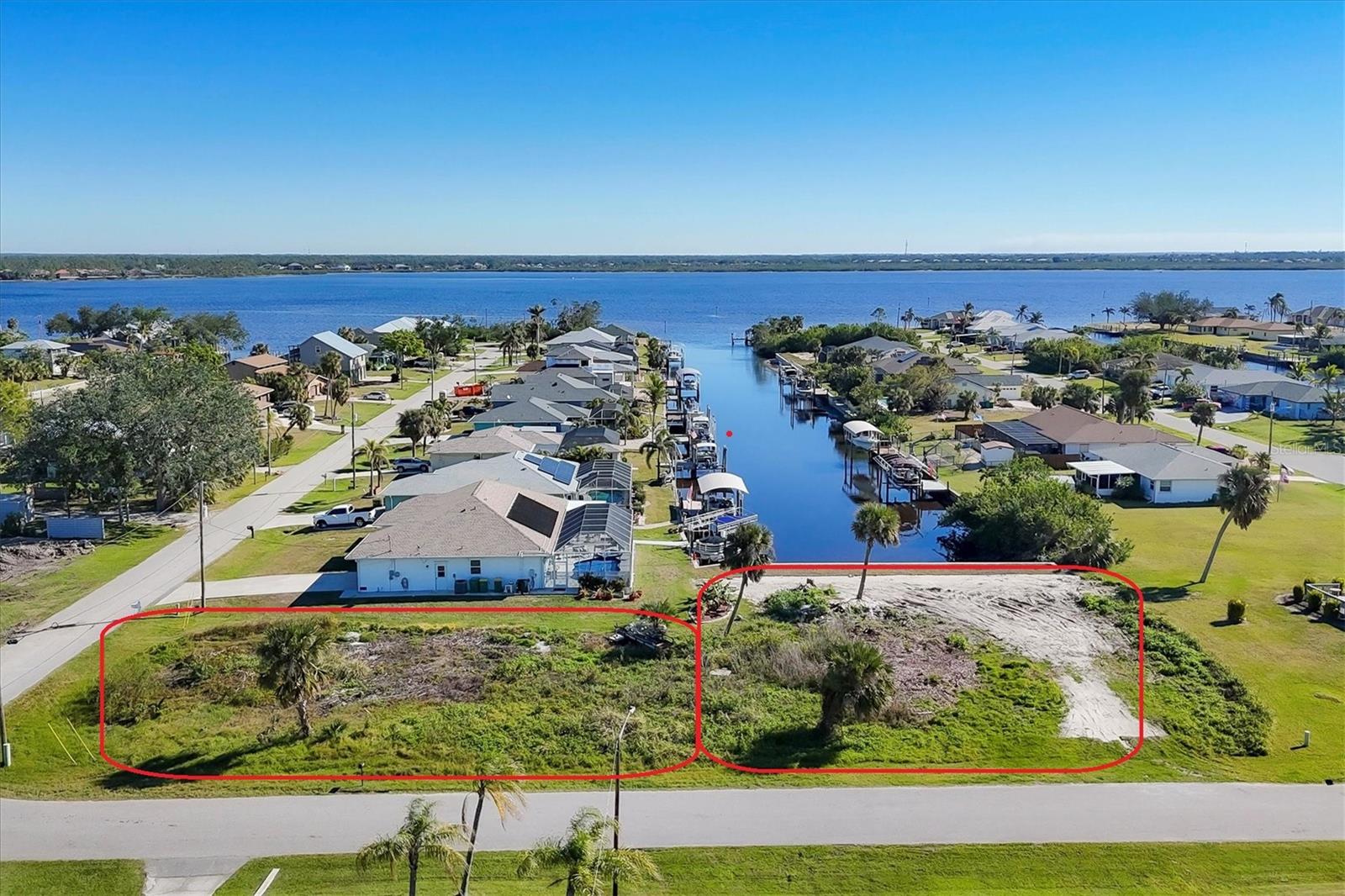 PRIME WATERFRONT VIEW & LOCATION! HALF-ACRE WATERFRONT buildable lot WITH BRAND NEW SEAWALL and DIRECT ACCESS to the GULF of MEXICO!! Here’s your opportunity to build your DREAM HOME in PARADISE on your END LOT with a VIEW STRAIGHT UP THE CANAL! The shimmering water is your back yard! This property offers TWO LOTS, 225 foot along the front of the property, and 100’ of WATER FRONTAGE in the back. The 100 ft CONCRETE SEAWALL was just installed and is ready for your dock and boat/boat lift! The canal leads to the Myakka River which leads to the Charlotte Harbor and Gulf of Mexico. Catch snook, redfish, snapper and shark from your seawall! Watch the dolphin and manatee as they come in to play and bathe. Come experience life in Gulf Cove – a friendly community of boaters, fishermen and sun lovers. Just 4 miles to the grocery store. We are happy to suggest phenomenal builders to construct your dream home, with a view! Call for local information today!