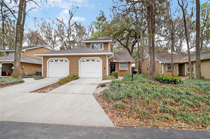 One or more photo(s) has been virtually staged. Welcome to this beautifully renovated home located in the desirable Vintage View community of Gainesville. This lovely residence features a unique triple-split floor plan, with the owner’s suite conveniently located on the main level for added privacy and comfort.

Offering 3 bedrooms and 2.5 bathrooms across approximately 1,700 square feet, the home has been thoughtfully updated throughout. Recent improvements include an updated kitchen, refreshed bathrooms, new interior paint, updated HVAC system, and water heater, along with many other enhancements that make this home truly move-in ready.

The spacious open great room is designed for both comfort and entertaining, featuring a cozy fireplace, built-in wet bar, and skylight that fills the space with natural light.

Additional interior highlights include a screened porch overlooking peaceful wooded areas, a one-car garage, and a versatile bonus alcove that could serve as an atrium, reading nook, or media space.

Residents of Vintage View enjoy community amenities including a pool, tennis courts, and clubhouse.

Ideally situated between The Oaks Mall and the University of Florida, this home offers convenient access to North Florida Regional Medical Center, UF Health, shopping, dining, and entertainment.
Call for YOUR VIP TOUR!