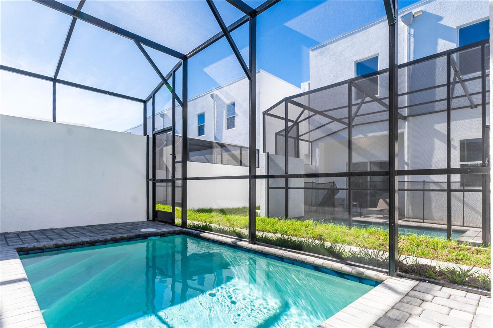 Experience the modern style of this 5-bed, 4-bath townhouse, complete with a private pool, in The Azur Resort. The soon-to-open clubhouse will enhance your living experience with its contemporary design, a stylish community pool, a playground, and a Health and Wealth Fitness Facility. This townhouse is ideally situated just three exits away from Disney, providing easy access to all the magic. Additionally, it's conveniently located near Aldi, Publix, Wawa, various shopping hubs, and the newly established Orlando Health Center. With swift access to I-4, you'll find Champions Gate and its golf courses less than a mile away. The property is fully furnished and currently vacant, ready for you to move in and enjoy. Don’t miss out on this fantastic leasing opportunity!