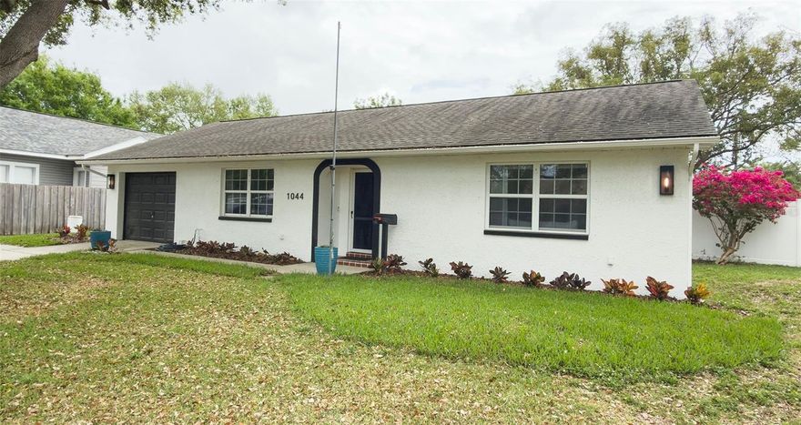 This stunning two bedroom, two bath home is in the Franklin Heights neighborhood of St. Petersburg, FL. High & Dry, no flood insurance required!  Energy efficiency thrives here with whole house solar panels (2017 – no transfer expense to new owner), thermal insulated panels in attic under roof decking, double paned, insulated windows & hurricane shutters keep your utility bill low and puts your mind at ease! AND did we say there is a deep well for irrigation, so no staining on the house and fence! This home has been thoughtfully updated. Kitchen design includes stainless appliances, (GE Microwave 2026, Kitchenaid dishwasher 2026 & Samsung refrigerator), white Kraftmaid cabinets (Shaker style) 2026, new under-mount sink with grate, Kohler faucet & water dispenser 2026. All perfectly accentuated with new, beautifully veined Quartz countertop. Water softener 2024, 3 ton TRANE A/C 2025, Dryer 2023. Kraftmaid cabinet, Kohler sink & faucet sparkle in the hall bath, also with stunning quartz countertop.  The owner’s bedroom is complete with a private en-suite bathroom. Recessed lighting throughout shows off the gleaming tile floors. The 12’ x 27’ air conditioned Sun Room provides incredible space, leading you to your gorgeous covered & paved backyard gazebo. Complementary outdoor lighting uses WIFI and app to help set the mood for any celebration! Large backyard and 6’ vinyl white fence (2024), professionally styled yard with a 12’ x 16’ shed. Walking distance to Robert’s Community Center Park.  Whole Foods, Publix and Trader Joe’s a short drive. Easy commute to downtown St. Pete, the Pier, hundreds of annual events, and world class museums and galleries, restaurants galore.