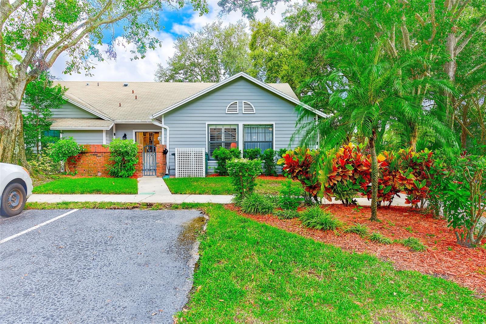 Welcome to this updated 2-bedroom, 2-bath villa in the desirable Village at Bentley Park community of Palm Harbor. Offering 1,390 sq. ft. of living space, this home features an open-concept layout with vaulted ceilings and abundant natural light.
The kitchen includes granite countertops, stainless steel appliances, and classic white cabinetry. A versatile den provides flexible space for an office, hobby room, or guest area. The primary suite features ample closet storage and an en-suite bath.
Enjoy outdoor living with an oversized custom screened patio with large added storage, perfect for year-round enjoyment. The villa is beautifully landscaped and surrounded by mature trees for shade and privacy. Located in Flood Zone X, no flood insurance is required.
The maintenance-free community provides exterior upkeep and resort-style amenities, including a pool, tennis courts, and landscaped grounds. Conveniently located near shopping, restaurants, banks, and medical services, with Gulf beaches just a short drive away—this is a must-see villa in this area!