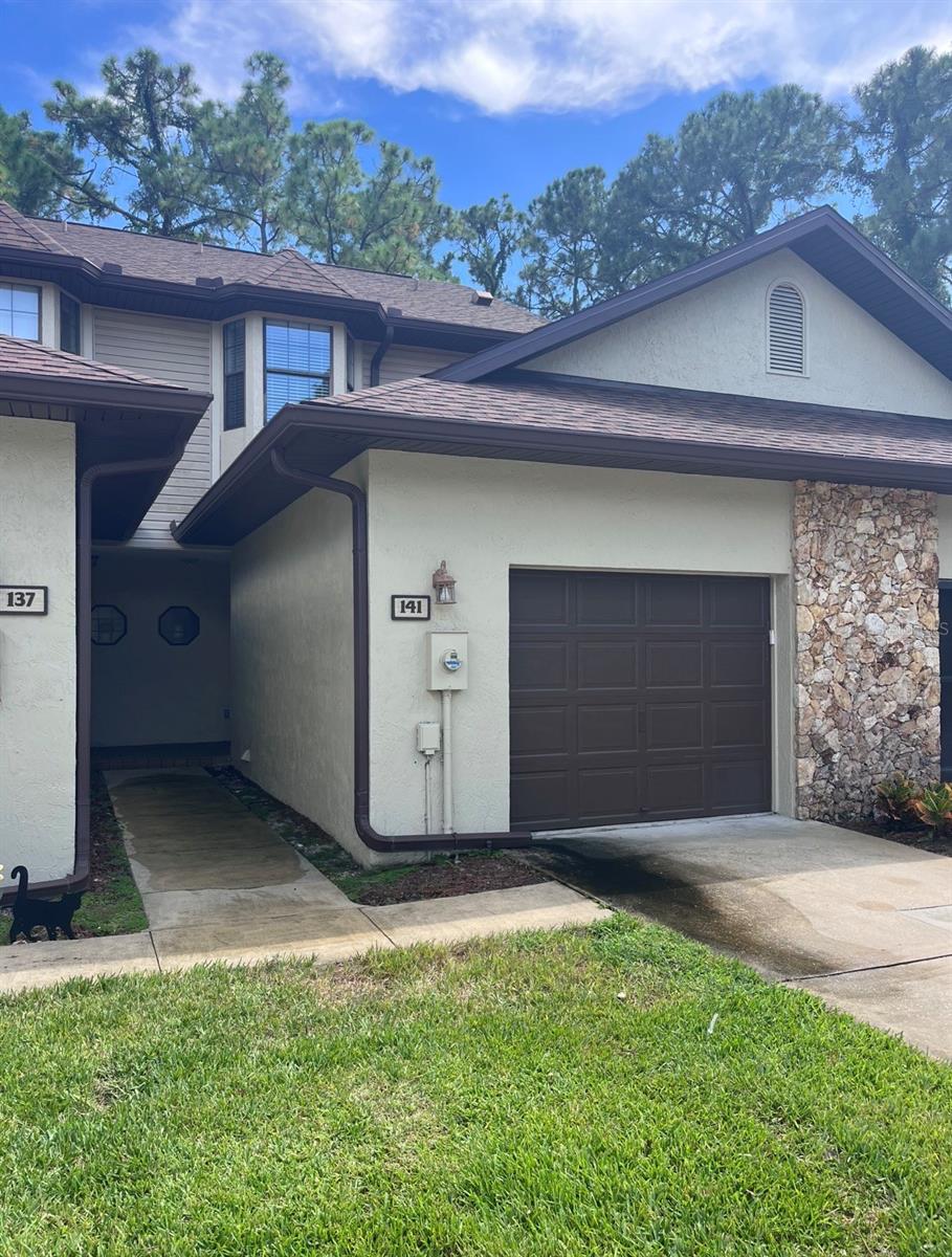 Photo of 141 Dovecote Lane, Daytona Beach, FL 32114 (MLS # O6449673)