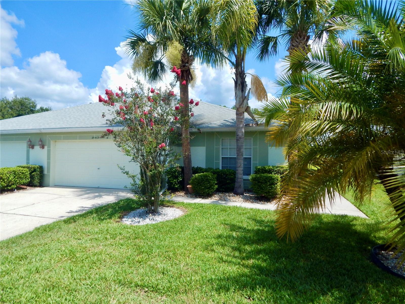 Welcome to your MOVE IN ready, maintenance-free Villa located in the desirable 55+ community of Tampa Bay Golf & Tennis Club! This charming 3-bedroom, 2-bath, 2-car garage VILLA offers casual elegance with a coastal blend of comfort and Florida lifestyle. Enjoy peaceful mornings and tranquil evenings from your screened-in and covered lanai. Inside, you'll find luxury vinyl plank floors throughout the common areas in this Light, Bright and OPEN concept home. RENOVATED kitchen has Granite Counter Tops and newer cabinents (2024), with a separate eat-in dinette area. The home is well-equipped with all the essentials dishwasher, disposal, garage door opener, ceiling fans, and all existing window treatments. Practical touches such as an interior laundry room with washer and dryer plus room for additional storage and the attached spacious 2 car garage all add to the appeal. This home is being offered As Is for seller convenience and furnishings are negotiable. Lawncare is included in the HOA so you will have plenty of time to Enjoy the Florida Lifestyle in this GATED Community, Just off I 75, for easy access to Tampa, St Pete, Ocala, Orlando, Wesley Chapel, Airports and the Beaches! As a resident, you'll have access to an impressive array of amenities, including a championship 18-hole golf course, a 9-hole executive course, two community pools, heated spa, tennis courts, pickleball courts, state of the art fitness center, activities center, clubhouse with ballroom and banquet facilities a full-service restaurant and pub bar/grill overlooking golf course, library with computer access, billiards, shuffleboard, horseshoe pits, two dog parks, onsite entertainment, travel excursions plus