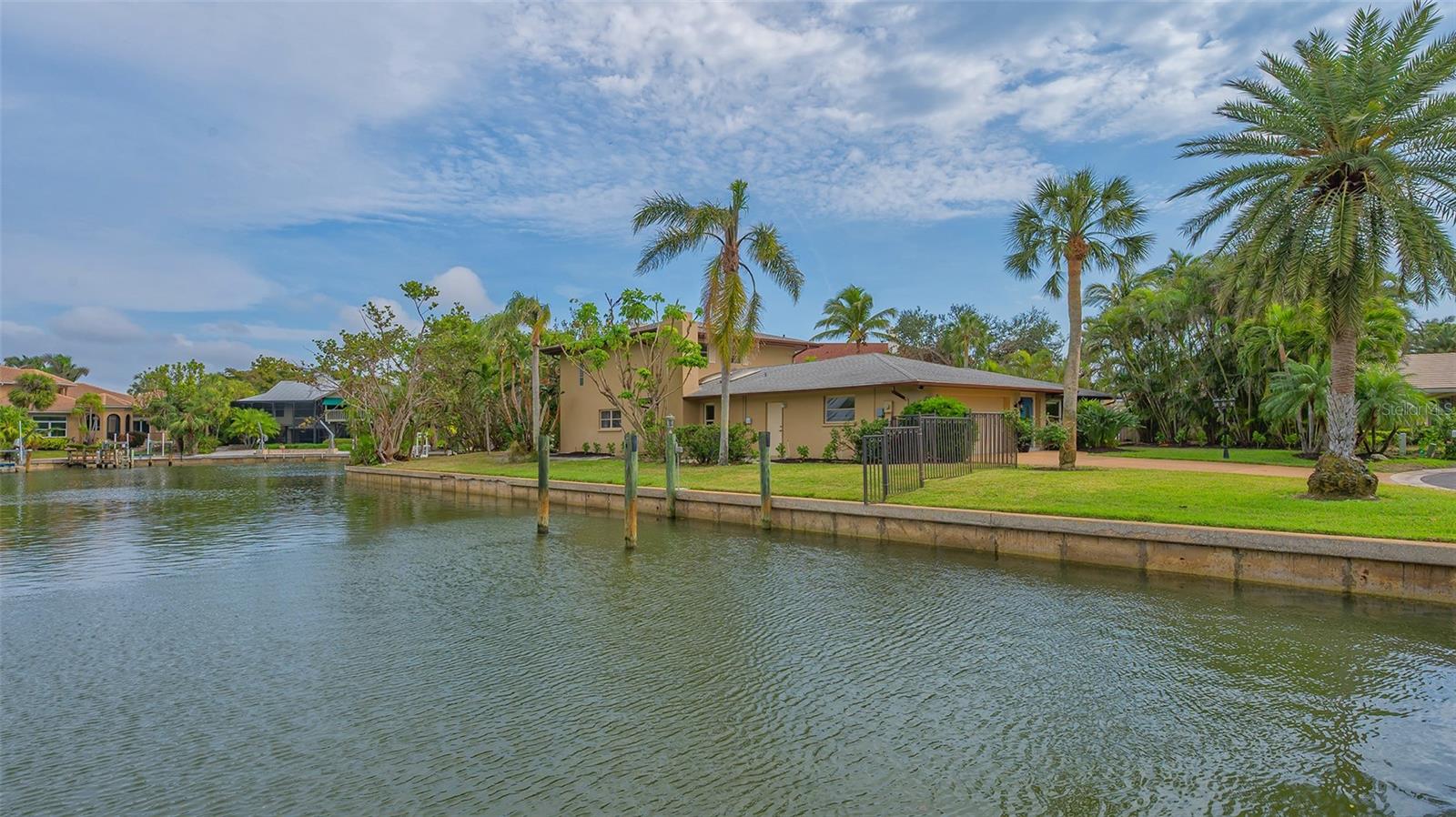 Exceptional New Price for Siesta Key Canal-Front Living.
Discover an unparalleled waterfront retreat on the highly coveted North Siesta Key, where luxury and tranquility converge. This extraordinary property boasts over 300 feet of pristine water frontage, offering breathtaking panoramic views and seamless access to Sarasota’s renowned waterways.
Spanning over 3,450 sq. ft. of professionally curated interiors, this 4-bedroom, 3-bathroom residence is designed to impress. Expansive living spaces flow effortlessly, highlighted by thoughtfully selected details and a welcoming ambiance. Walls of glass invite natural light while capturing the serene waterfront backdrop.
Step outside and experience an additional 1,274 sq. ft. of outdoor entertainment living, complete with a large, resort-style pool—perfect for refreshing swims, soaking in the coastal ambiance, and entertaining under the Florida sun. Nestled on a generous 15,000+ sq. ft. lot in an enclave of estate homes, this property presents limitless possibilities.
A rare value in today’s market, this home is priced $600,000 below its recently appraised value, an incredible opportunity for buyers seeking luxury, location, and equity.
A true boater’s paradise, this residence delivers unmatched privacy, premier location, and boundless potential. Don't miss this rare opportunity to own a one-of-a-kind waterfront sanctuary on North Siesta Key.