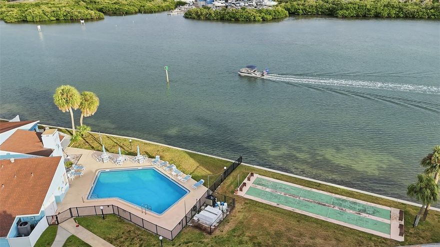 Just bring your clothes & toothbrush! Welcome to this completely renovated, fully furnished, turnkey first-floor condo offering 2 bedrooms and 2 bathrooms, ideally located on the Intracoastal. This one-story unit features a bright sunroom along with private outdoor patios at both the front and back perfect for enjoying Florida’s indoor-outdoor lifestyle. No stairs easy walk-up access 
Whether you’re looking for a highly desired vacation rental, second home, or full-time residence, this condo checks every box. All ages welcome. The unit is being sold fully furnished and truly turnkey, including linens, an extra pull-out bed, beach chairs, fishing poles, and more.
Additional highlights include in-unit laundry walk in closet in master, assigned covered parking, and private storage just steps from the unit. (#35) Recent upgrades include an updated electrical panel, HVAC (2019), water heater (2025), and Hurricane impact windows and sliders (2021).
*** HOA fee covers cable TV, internet, pest control, sewer, trash, water, community pool, exterior maintenance, and grounds maintenance, ensuring truly hassle-free living. Walking distance to the sandy Gulf beaches, the famous Indian Rocks water park, and local dining and entertainment, this property offers both tranquility and activity right at your doorstep. This unit will NOT LAST!