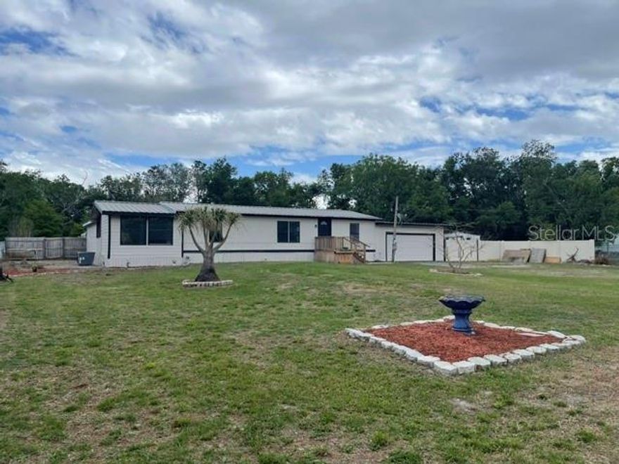 Great location, .76 acres, NO HOA, property is fully fenced. 2 back to back "2 car" garages with overhead door openers, connected to house. Large metal shed with overhead door at rear of property. The Primary bedroom has an attached workout room with rubberized flooring, plus an en-suite bathroom.  
The hidden gem of this property is the MONSTER SIZED 46'X 24' fully screened & roofed attached rear porch-gathering center. You must see this to appreciate its size and amenities.  Outdoor kitchen, grill, range, a full sized fridge, plus a commercial sized stainless steel built in refrigerator/cooler. Double sink with attached Food Prep counter. Built-in commercial cooking unit for oysters etc. Pool Table, Ceiling Fans, Raised stage area on one end (Karaoke anyone?)with bar & attached swings like a cruise ship, Large Koi pond. Large Hot Tub.  This is a perfect location for parties, wedding receptions, graduation celebrations etc., etc. Just outside the screen porch door is a fire pit with 3 double chain swings. The possibilities for this unique residential property are endless.