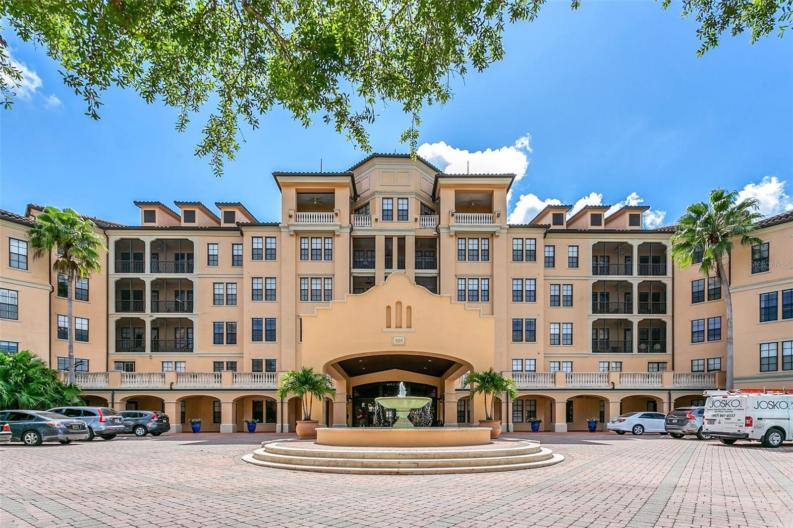 One or more photo(s) has been virtually staged. Just the lifestyle you’ve been waiting for! This rarely available corner residence on the 4th floor offers breathtaking views of the Nature Preserve, a bird’s-eye view of Celebration, and a relaxing overlook of the resort-style pool — all from your spacious private screened patio.
Inside, you’ll find bright, open living spaces, soaring 10-foot ceilings with crown molding, and a thoughtfully designed split floorplan with two bedrooms. The owner’s suite is your personal retreat, featuring a generous walk-in closet and a spa-like bath with a Roman soaking tub and separate shower.
The eat-in kitchen comes fully equipped with stainless steel Whirlpool appliances, upgraded cabinetry, and a stylish backsplash. Wood flooring, a beautifully renovated second bath, fresh interior paint (2024), and new carpet show the pride of ownership — all the upgrades you’d want, already done for you, so you can move in with ease.
Mirasol at Celebration showcases award-winning architecture and an array of top-notch amenities designed to enhance your lifestyle, including an on-site day spa, a fully equipped 24-hour fitness center, on-site professional management services, a resort-style heated pool and spa, a resident clubroom with billiards, and a business center with a private conference room and cyber café. Nestled in the vibrant Celebration Village, you’ll have access to 26 miles of scenic trails and be just a short distance from the town center, offering fine dining, eclectic shops, and entertainment options, as well as tennis courts. Plus, enjoy the convenience of being minutes away from Walt Disney World, Sea World, and Universal Studios, with the airport only 20 minutes away. Assigned parking space #89 is included. The seller is also offering a limited opportunity to purchase a covered carport for $40,000. Don’t miss the chance to add this rare convenience to your new home. Competitively priced and move-in ready, this home is a rare find that won’t last long! Schedule your viewing today!