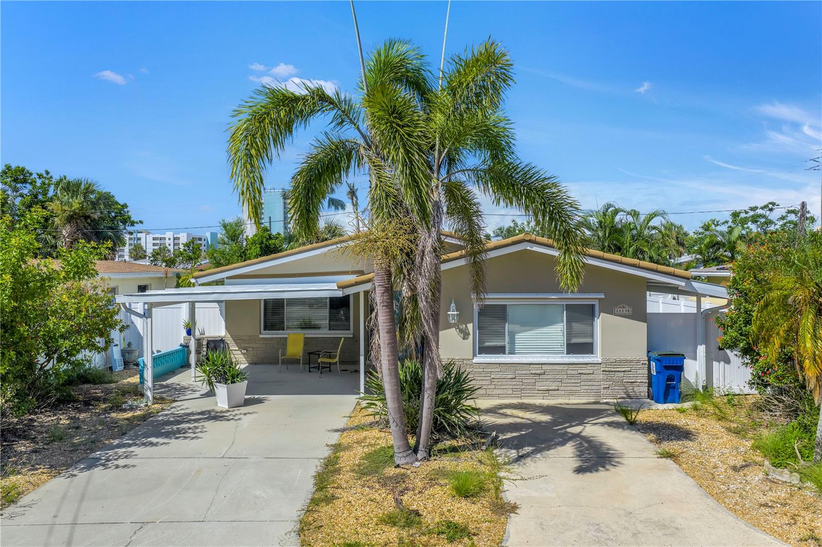 Located in the highly desirable Isle of Palms neighborhood, just two blocks from the sugar-white sands and sparkling waters of Treasure Island Beach, this solid block home offers an unbeatable location and endless possibilities. Enjoy being within walking distance of beachfront dining, shopping, entertainment, and the iconic Johns Pass Village, making this property a prime choice for investors or anyone dreaming of a Gulf Coast retreat and island living. The home's current layout features 3 bedrooms and 2 baths, with tile flooring throughout, newer windows, spacious closets, and ceiling fans in every bedroom. Each bedroom has its own door leading to the fully fenced yard with durable white vinyl fencing. Additional highlights include covered front and side porches, interior laundry, and a barrel tile roof. While the property did sustain flood damage from Hurricane Helene, its solid structure provides a great foundation for a relatively simple renovation or a complete redevelopment project. Offered as-is, the home has been professionally remediated and offers a rare chance to build your dream home or an income-producing investment in one of Treasure Island's most sought-after communities. No inspection contingencies. No assignable contracts or subject-to-offers will be accepted. Schedule your private showing today and unlock the potential of this Island gem!