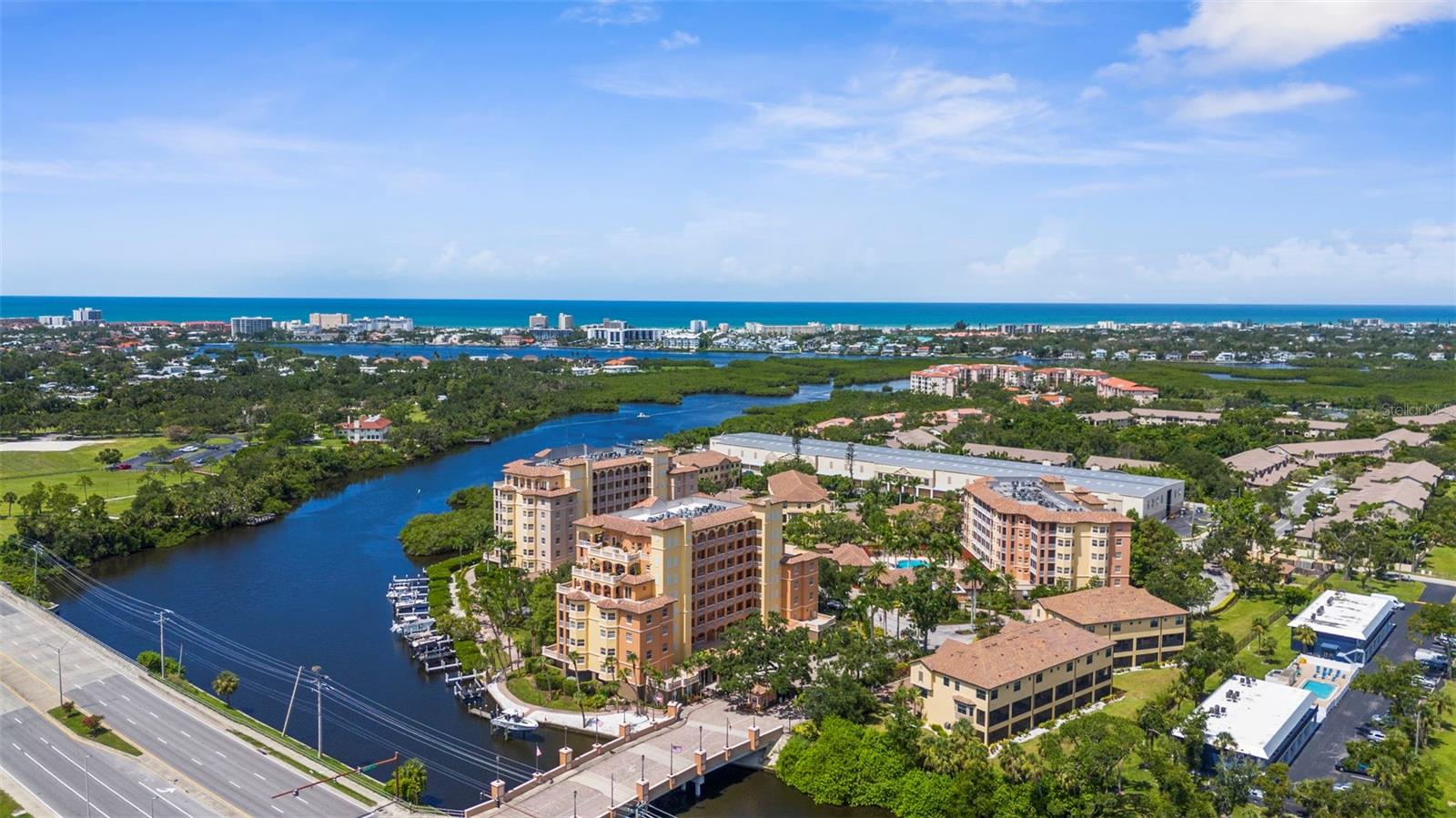 Welcome to Unit 405 at 1921 Monte Carlo Drive – a stunning waterfront community and fourth floor condominium offering the perfect blend of comfort, convenience, and coastal charm. Located just minutes from the award-winning sands of Siesta Key Beach, this residence delivers the Florida lifestyle you've been dreaming of. Enjoy the ease of direct elevator access leading straight into your private foyer – a rare and desirable feature that enhances both security and exclusivity. This spacious unit includes 2 bedrooms, 2 bathrooms, den/office, kitchen with granite countertops and bar seating, nice open floor plan, private balcony, a covered parking space and dedicated storage, ensuring convenience and functionality in every detail. You cannot forget the primary bedroom with direct access to the balcony, and a generously sized on-suite bathroom with duel vanities, large shower and soaking tub. From your private balcony, take in tranquil water views and ambiance that makes this location so special. Whether you're entertaining guests or enjoying a quiet evening at home, the open floor plan and natural light create an inviting and elegant atmosphere. The Phillippi Landings gated community features a clubhouse, indoor gym, heated swimming pool, dog park, lighted boardwalk. Also enjoy time on your paddleboad or kayak with the provided launch area. The boat slips are privately owned but don't worry, there's dry boat storage at the Phillippi Harbor Club is right next door! Schedule a showing today. Select photos have been virtually staged.