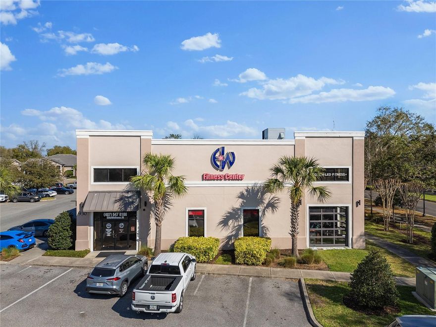 Introducing one of the most recognizable buildings on International Parkway. The 930 building stands tall, boasting two prominent stories, large garage doors, ample parking and 7,392 square feet of upscale space directly on Lake Mary's affluent thoroughfare, International Parkway, with nearly 16,000 in daily traffic count. Busy Central Parc Plaza, anchored by Starbucks Coffee with high-profile neighbors and a wealthy demographic, is ideal for business owners wishing to expand into the desirable demographic of Lake Mary and surrounding areas. High exterior finishes of stucco and stone are trademarks of Central Parc. Enjoy easy access to Interstate 4, the 429 and 417 beltways, multiple high-end businesses, luxury apartments and the most well-to-do communities in Central Florida. Designed as a luxury fitness center, this property features a welcome desk, large open two-story floor area, a private room for storage or sublet space, a second-floor open area with a private office, multiple restrooms and showers, and unlike many gyms, plenty of natural light thanks to the large garage doors and high windows flanking the structure.