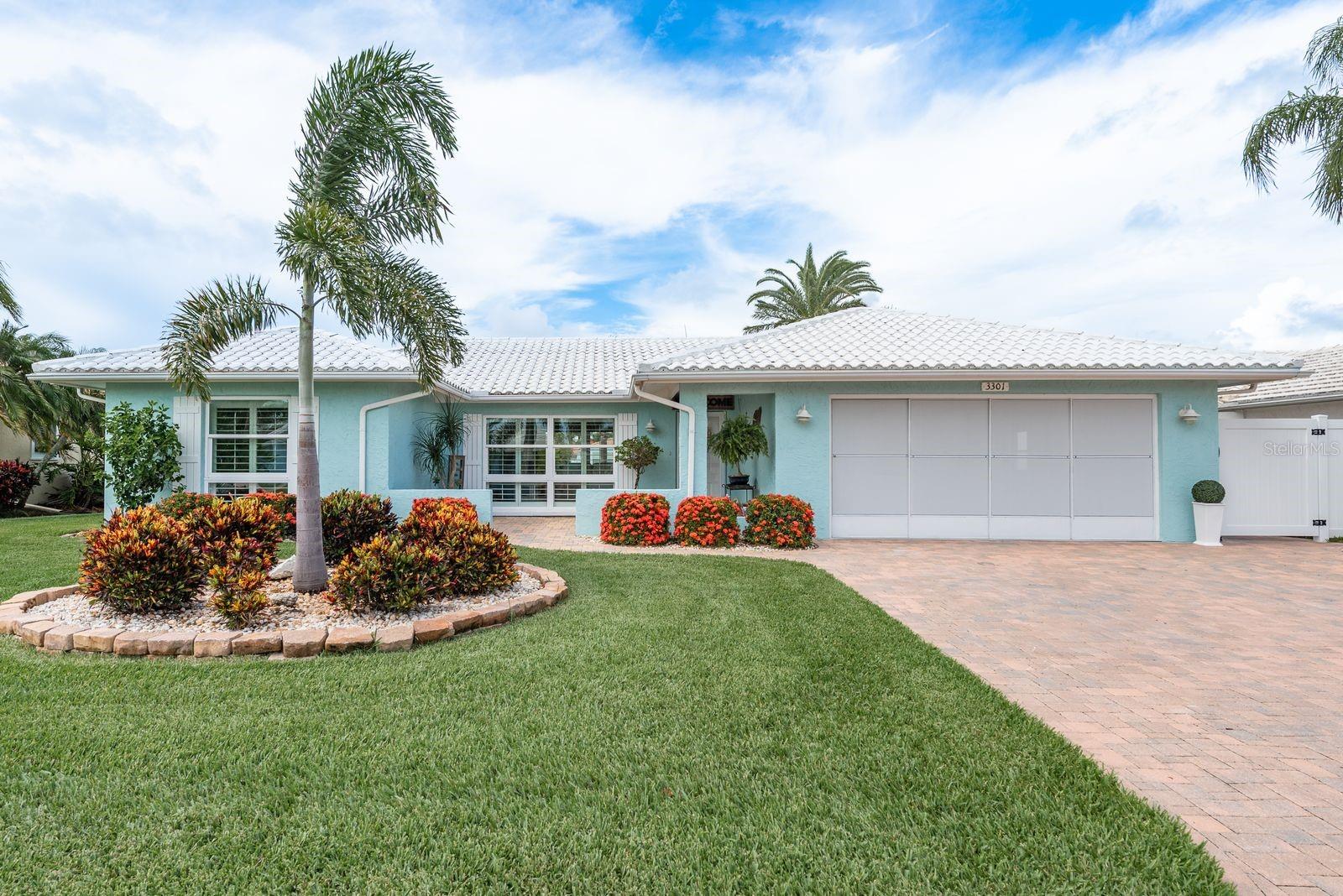 Welcome to your dream waterfront retreat at 3301 Seaway Drive, located in the highly sought-after boating community of Gulf Harbors in New Port Richey. This beautifully updated 2-bedroom, 2-bath home offers 1,640 square feet of thoughtfully designed living space on one of the widest and deepest sailboat-friendly canals in the neighborhood—just minutes to the open Gulf with no bridges to navigate. The home sits on a large lot with 75 feet of seawall, and a floating dock, making it a true boater’s paradise. Inside, the open floor plan provides privacy and functionality, while the updated kitchen features a beautiful island, quartz countertops, white cabinetry, retractable outlets and new stainless steel appliances. Luxury ceramic tile, plantation shutters, and crown molding that add comfort and style throughout. The spacious primary suite includes sliding doors leading to the bar and outdoor entertainment area, a walk-in closet, and a private bath with a step-in shower. You are going to love all the natural lighting this home has to offer.
Step outside to enjoy your outdoor space, lush landscaping, and fenced yard perfect for entertaining or relaxing in the Florida sun. Recent upgrades include new baseboards, flooring throughout, quartz countertops and fixtures in bathrooms, new blown-in insulation, new pavers, freshly painted and new landscape.
Gulf Harbors offers an optional private beach club just two blocks away for only $200 per year, featuring white sand, cabanas, grills, and stunning sunsets. The optional Civic Association membership ($125/year) includes access to community events, clubs, and two boat ramps. Located close to downtown New Port Richey’s shops, restaurants, Sims Park, and the scenic Cottee Riverwalk, this home offers the perfect blend of coastal charm, modern upgrades, and unbeatable location. Don’t miss your chance to live the Florida lifestyle—schedule your private showing today!