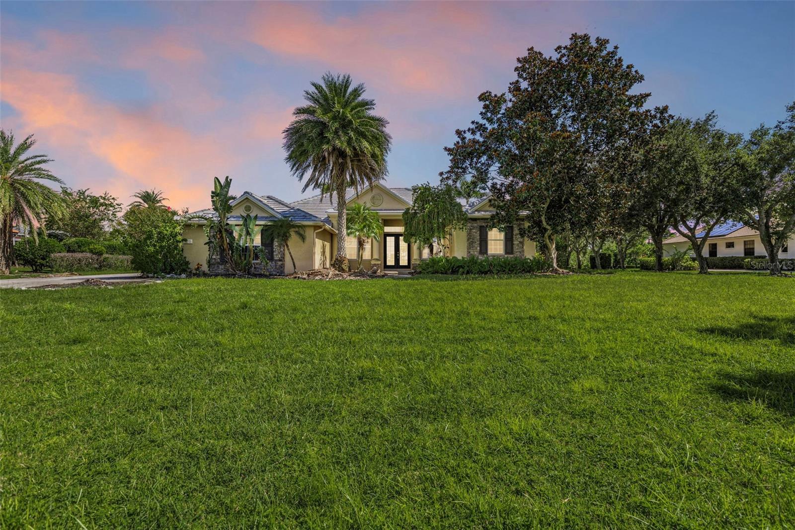 Welcome to 22575 Morning Glory Circle, a stunning 4-bedroom, 3-bath home with a spacious 3-car garage in Bradenton. Designed for comfort and entertaining, this home features an open-concept layout with soaring ceilings, abundant natural light, and modern finishes throughout. The gourmet kitchen boasts stainless steel appliances, a large island, and ample storage, flowing seamlessly into the living and dining areas. The luxurious primary suite offers a spa-like bath and walk-in closet, while three additional bedrooms provide space for family, guests, or a home office. Step outside to your private Florida retreat — a screened lanai with a sparkling pool, surrounded by a beautifully landscaped yard and supported by a full irrigation system. This property is a must see!