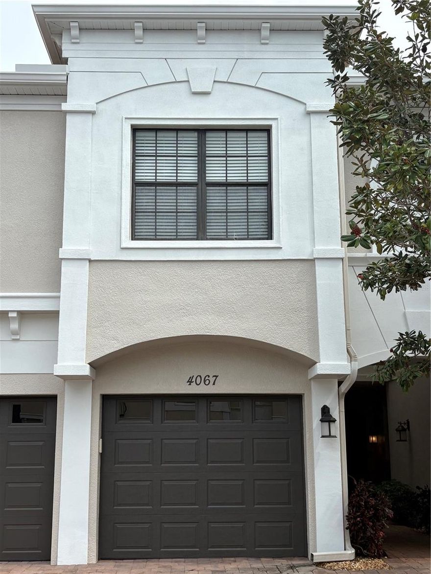 Welcome to your beautiful home and relaxing haven! This prime location offers easy access to fun and sun! This is a beautifully appointed second-floor Berkeley model condominium located in the highly sought-after Palma Sola Trace Community of Bradenton, Florida. This move-in ready 2-bedroom, 2-bath residence offers 1,228 square feet of stylish and functional living space. Palma Sola Trace is an immaculately maintained, mixed residential community.

Enter through your private one-car garage into a tiled foyer and head upstairs to the spacious open-concept layout featuring high ceilings, ceiling fans, and wood-look tile flooring. The kitchen is a standout with granite countertops, 42" maple cabinetry, a deep sink, and a breakfast bar that opens to the living and dining areas. Just off the kitchen, you’ll find a stackable washer and dryer for added convenience. The living area extends to a screened lanai with stylish sliding louvre doors, perfect for enjoying your morning coffee or evening breeze while overlooking the lush greenbelt.

The spacious primary suite includes a walk-in closet and ensuite bath with a glass-enclosed shower, granite topped vanity, and natural light from the high window. The second bedroom, shares a Jack-and-Jill style bathroom with a tub/shower combo, glass sliding doors and granite topped vanity. Residents enjoy access to resort-style amenities including a lagoon-style heated pool, a well-equipped fitness center, a clubhouse with a catering kitchen and lounge areas, and a playground. The HOA fee covers exterior maintenance, cable, internet, pest control, and more! Palma Sola Trace is a pet-friendly community with no size restrictions. The lush and well maintained greenery lends to pleasant walks.

Conveniently located less than five miles from the beaches of Anna Maria Island where sun, fun and endless water activities abound! Shops and restaurants aplenty including a walkable shopping plaza with FirstWatch, HomeGoods, Winn Dixie and more! You are a quick drive to the vibrant downtown of Sarasota! In addition, a new City Center with Publix, eateries and retail is planned for the end of 2026! This location offers the best of Florida living! Whether you're looking for a full-time home, seasonal retreat, or investment opportunity, 4067 Overture Circle delivers comfort, convenience, and a vibrant coastal lifestyle. Schedule your tour today!